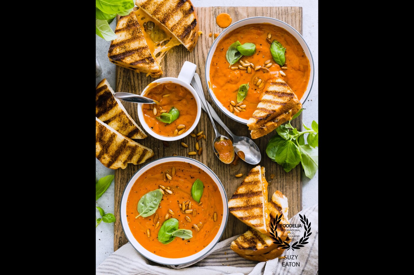 It doesn’t have to be cold outside to enjoy this childhood favorite! Tomato soup and grilled cheese sandwiches. But this soup takes it to the next level...with a little basil! 