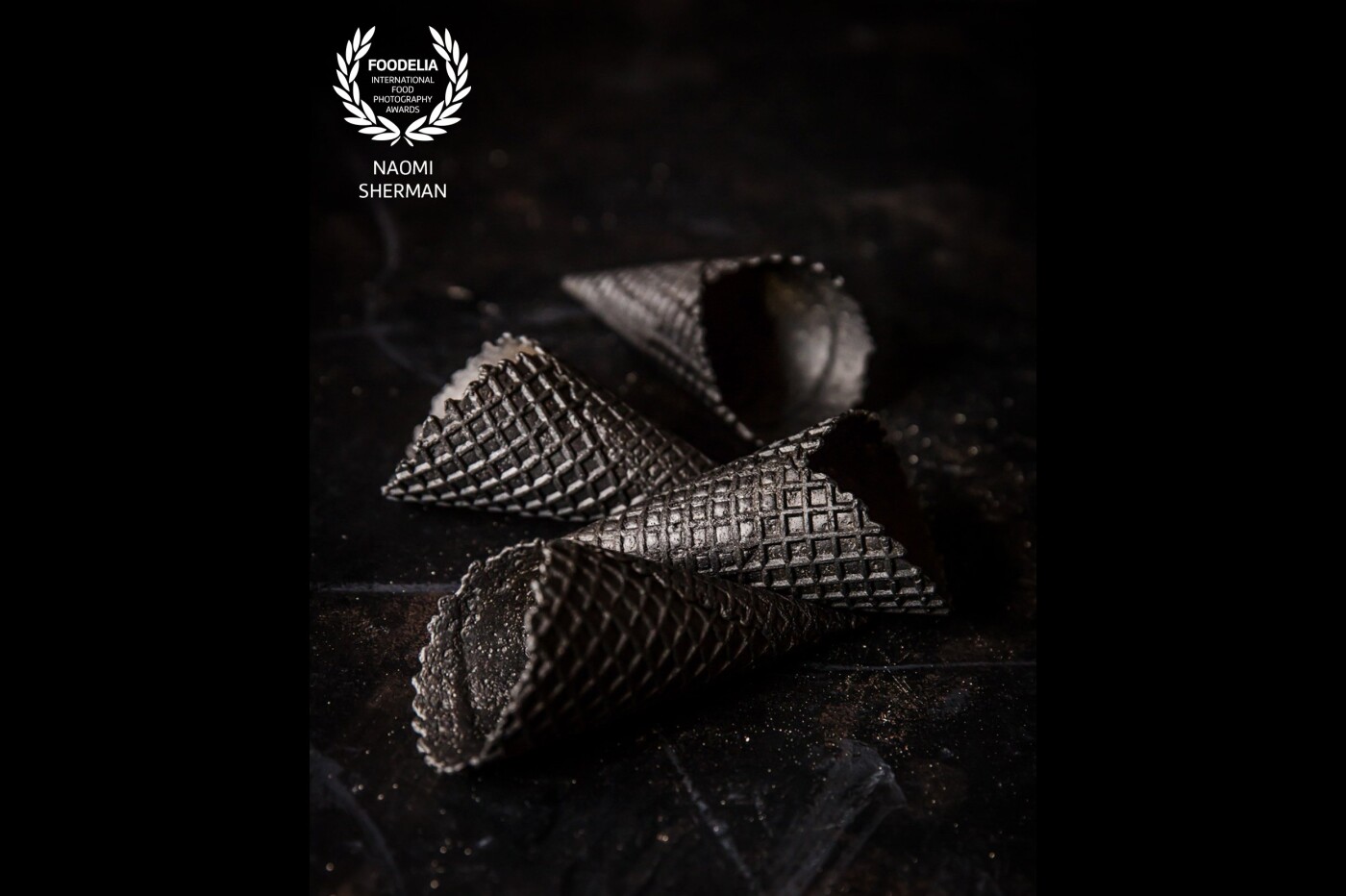 These black waffle cones were shot in my studio, using natural lighting.<br />
I particularly liked the play of light and shadow across the texture of the cones