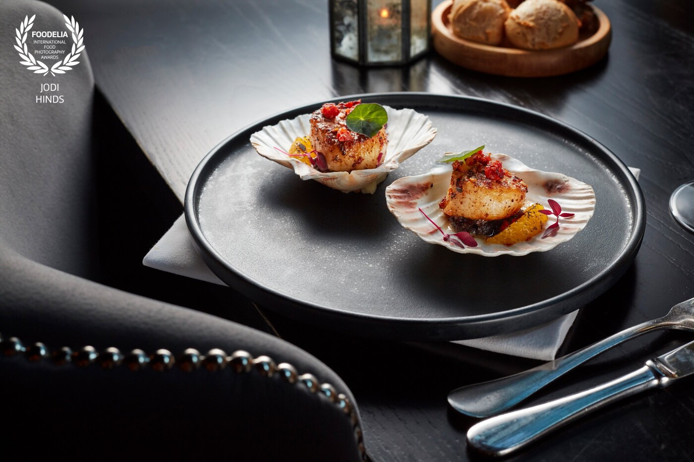 New menu shot at Gaucho - the Argentine steak restaurant group in the UK and Dubai. These are the delicious seared scallops, served in the shell with blood pudding, spiced orange butter, charred orange, chorizo crumble and nasturtium.<br />
Restaurant: @gauchogroup<br />
Owner: @martinwilliams32<br />
Photographer: @jodihindsphoto