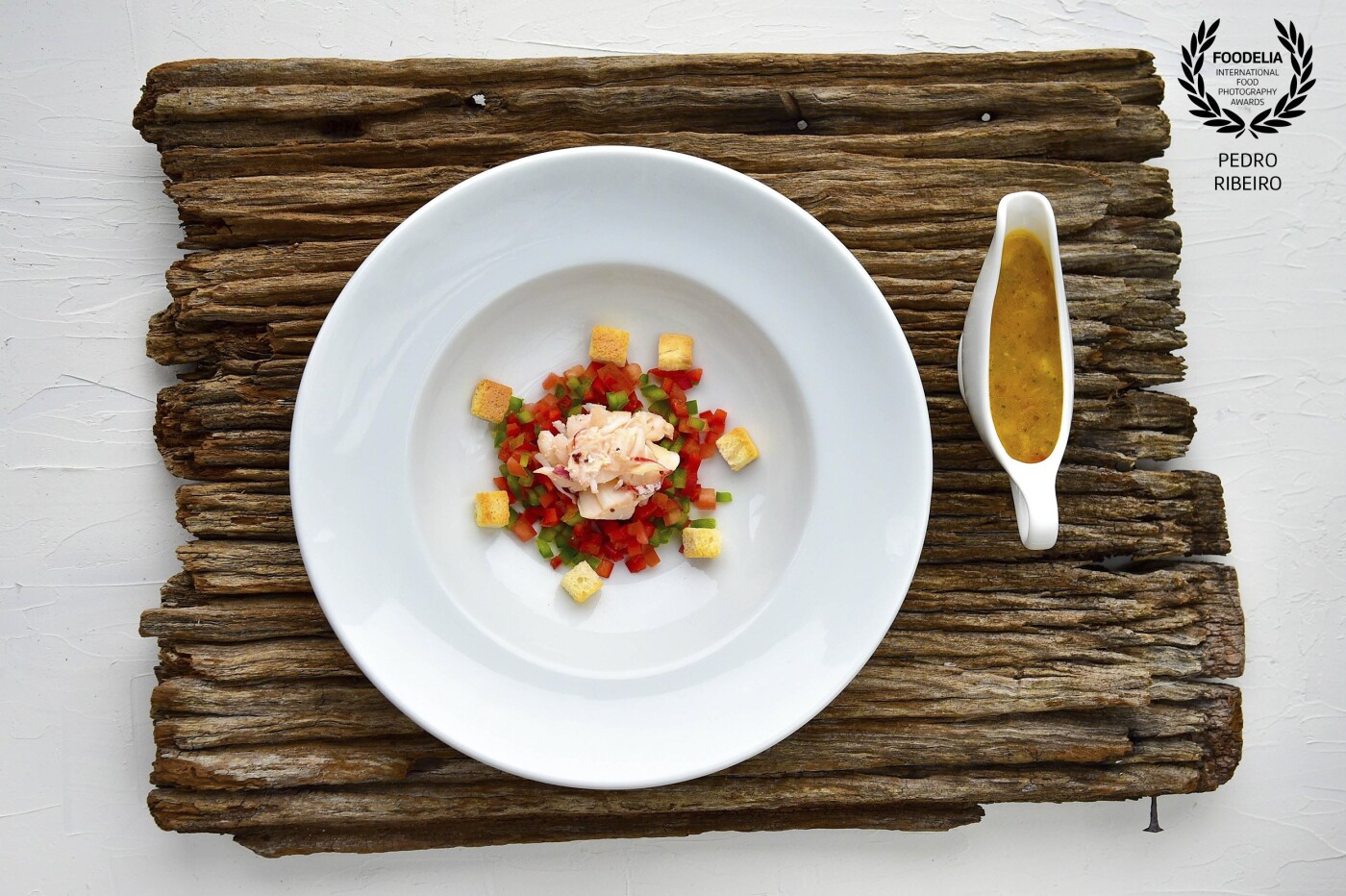 This photo of crab soup,  with green and red pepper was made for a promotional brochure of the Gardens restaurant, located in Lisbon.<br />
