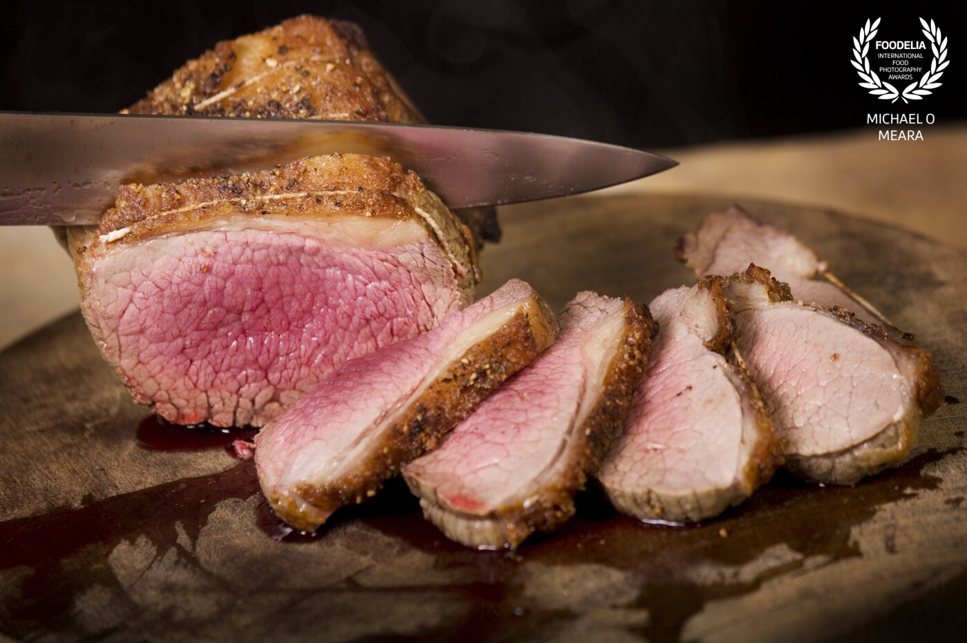 Roast topside of beef cooked medium rare is a real classic. The secret is allowing the beef to relax for at least 10-15 minutes before carving and shooting the picture just as the beef is cut to capture the succulent juices. 