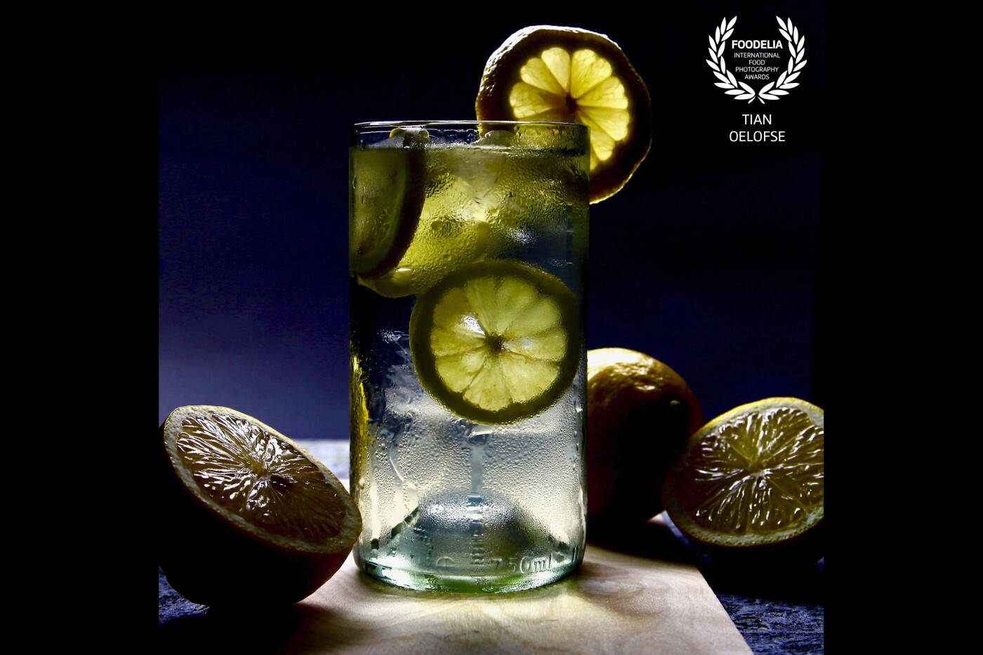 - Quench - <br />
The simplicity of a glass of refreshing Lemon water. Part of our daily lives & often unnoticed.  Play of light & Shadow through water & lemons. 