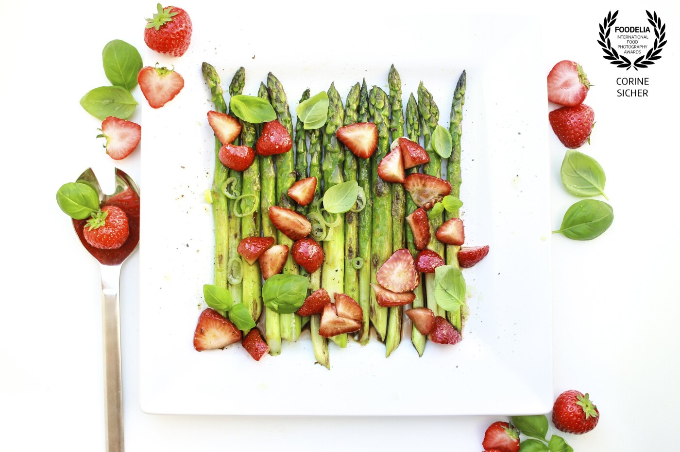Spring is here. I made a quick salad with asparagus and strawberries, the perfect combination in color and on the plate. <br />
Shooting with natural light and some reflecting sheets of white paper. 