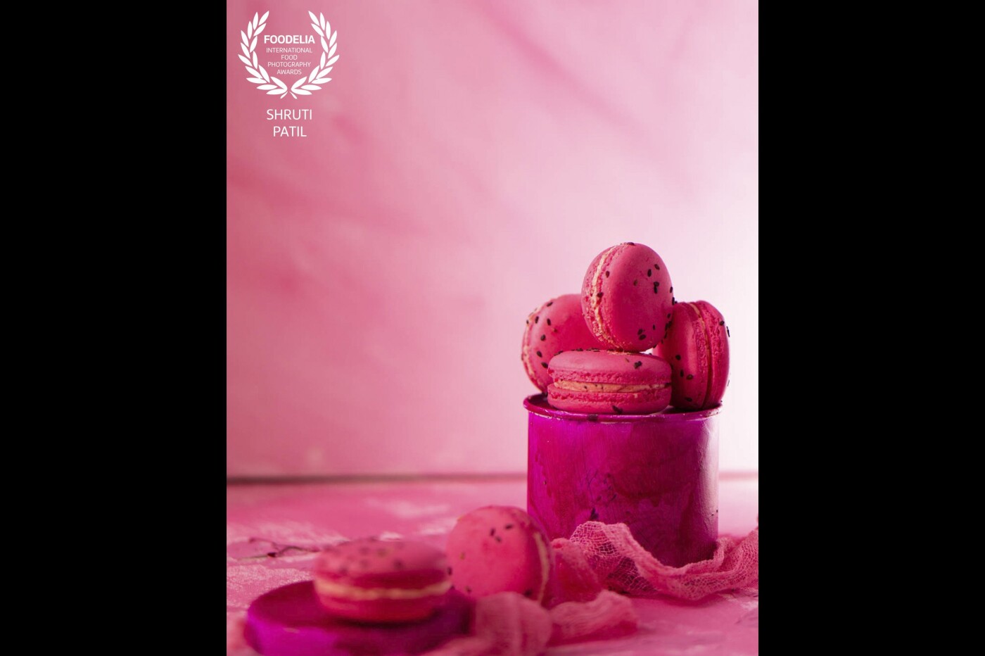 This styled image has the inspiration of macarons like a glamorous, gorgeous pink diva in the spotlight, the show stopper in a monochrome styling that shows off the texture of the subject. 