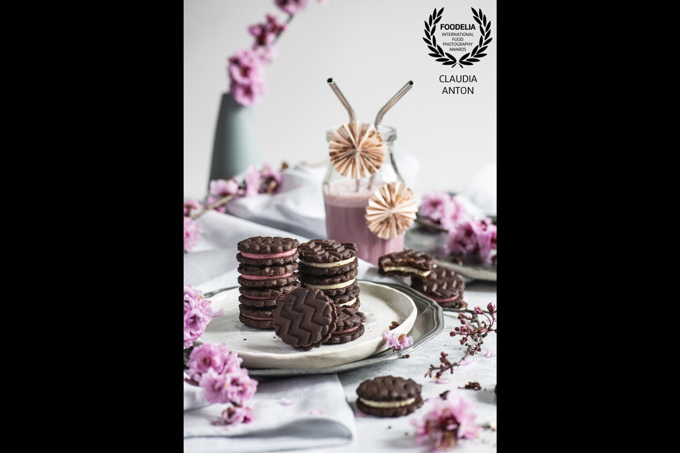 Raspberry and vanilla Oreos with pink milk and blossom. A play in pretty pinks and greys inspired by new neighborhood plum blossoms and special handmade ceramics created by one talented little daughter.  To be able to smell the sweet blossom would perfectly complete this scene!