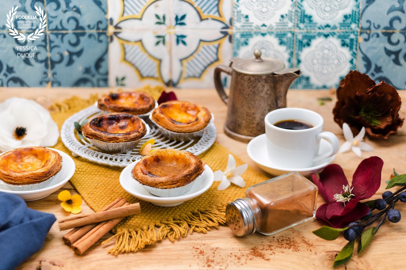 Pastéis de Nata<br />
Feeling inspired by Portuguese vibes and these delicious tartlets recommended by my favorite Portuguese shop in Leidschendam @marqasa.nl; handmade paper flowers made by the incredible artist @anoukbohmer definitely compliment the mood and brings me back to any cozy coffee place in Lisbon.<br />
Camera: Canon 5D Mark III<br />
Lens: 50 mm <br />
Settings: ƒ/2.8 1/125 ISO100 daylight