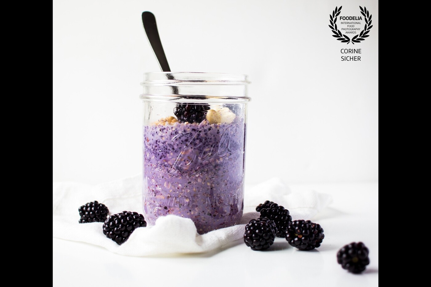 Overnight oats with blackberry and buttermilk. I love my colored oats - mixed with blackberry-fruit-powder and fresh berries. Shot this beautiful jar with natural light, reflection on the left and behind. Best came afterward, eat it all up by myself. 