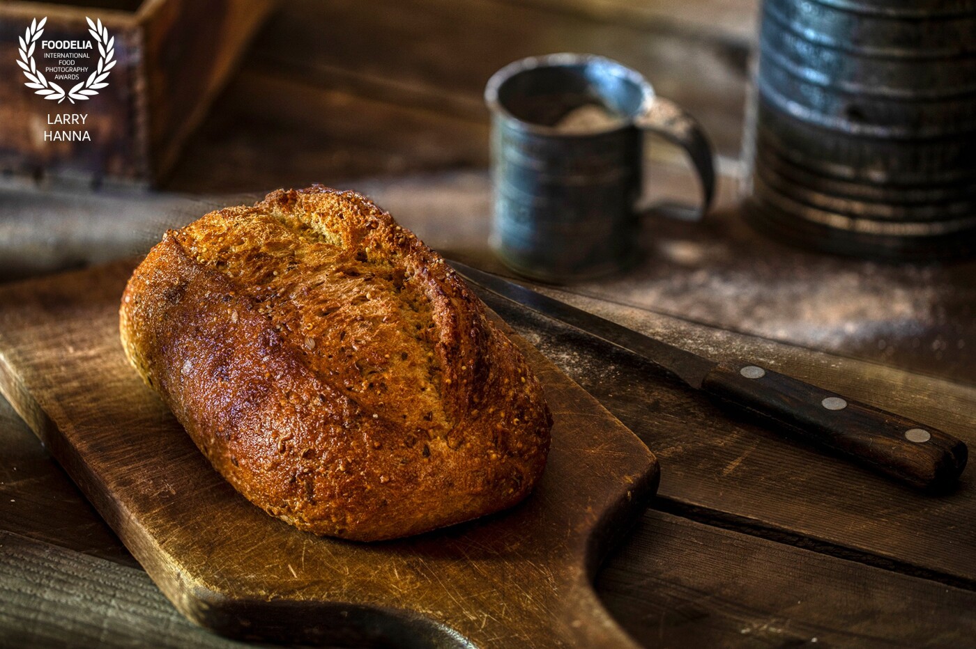 This image was created for my portfolio and my own creative enjoyment.  I created a set in my kitchen and photograph the bread using natural light.