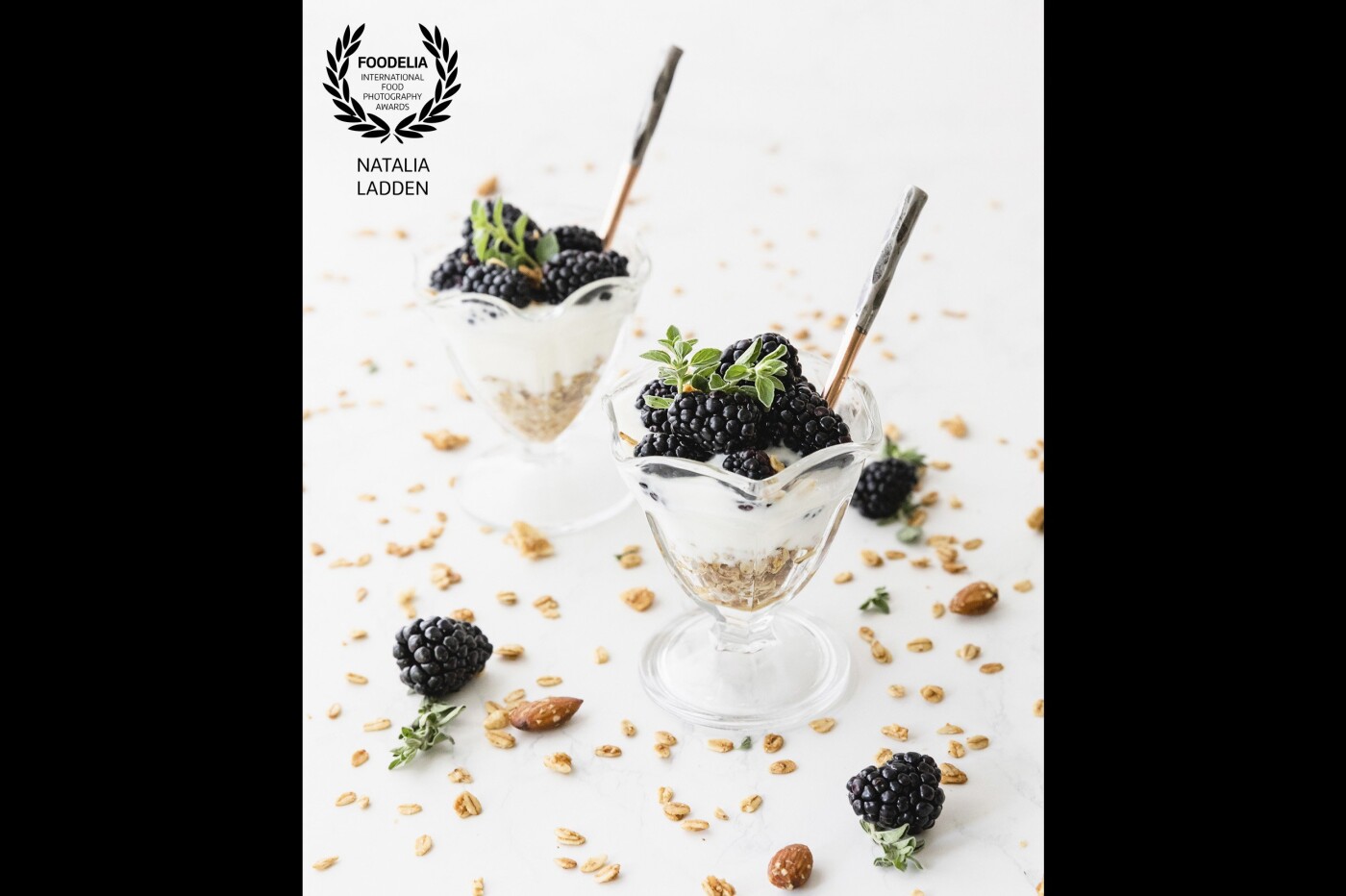 Granola and creamy yogurt parfaits topped with ripe blackberries. This series of shots were set up and shot in natural light and eaten right after :)