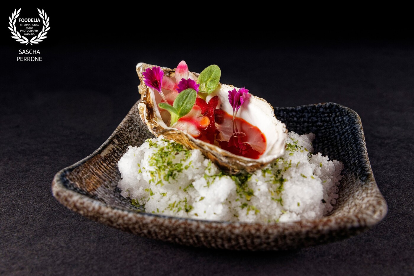 A dish by chef Lukas Jokobi in the modern European-Asian fusion Restaurant "zweigleisig" in Düsseldorf: oyster with fermented beetroot and gin.