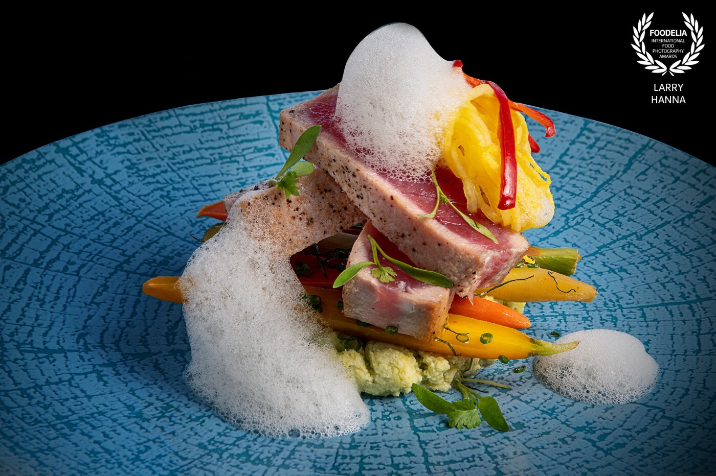 This beautiful creation was photographed for the Top of the World restaurant inside the STRAT Hotel & Casino in Las Vegas.  Their chef prepared this ahi tuna, with spaghetti squash, and  petite veggies and was styled by Amy Villareale.