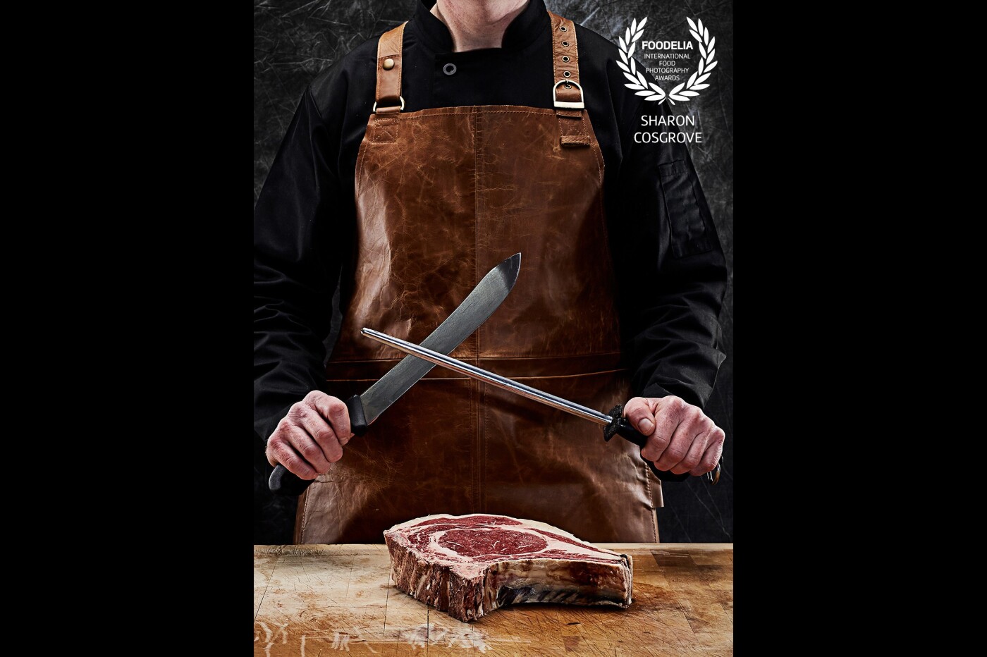 This shot was taken as part of a series of shots for a butcher's shop near my hometown.  They wanted to emphasise the tools used for traditional butchery including the butchers steel and the block on which the meat rests.  The meat of course is the real star.  I was very happy with how the images turned out as it was shot on location in a very, very cold refrigeration unit with stone floors and little comfort!  
