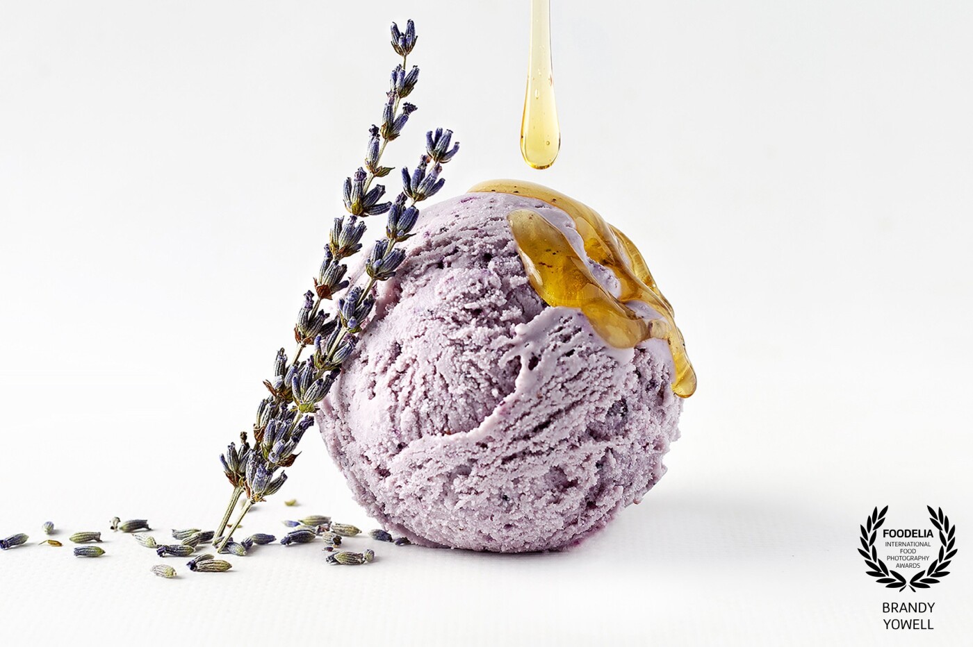 Honey lavender ice cream, shot created for a local organic ice cream shop. One light set up with bounce card. Three image composite. 