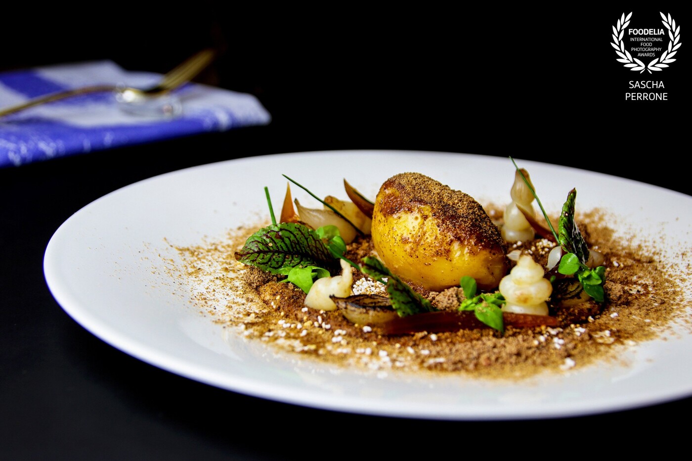 A creative dish called the potato field with potatoes, onions and herbs from 1 star MICHELIN chef Benjamin Kriegel in the FRITZ's FRAU FRANZI restaurant at THE FRITZ Hotel (Düsseldorf, Germany).
