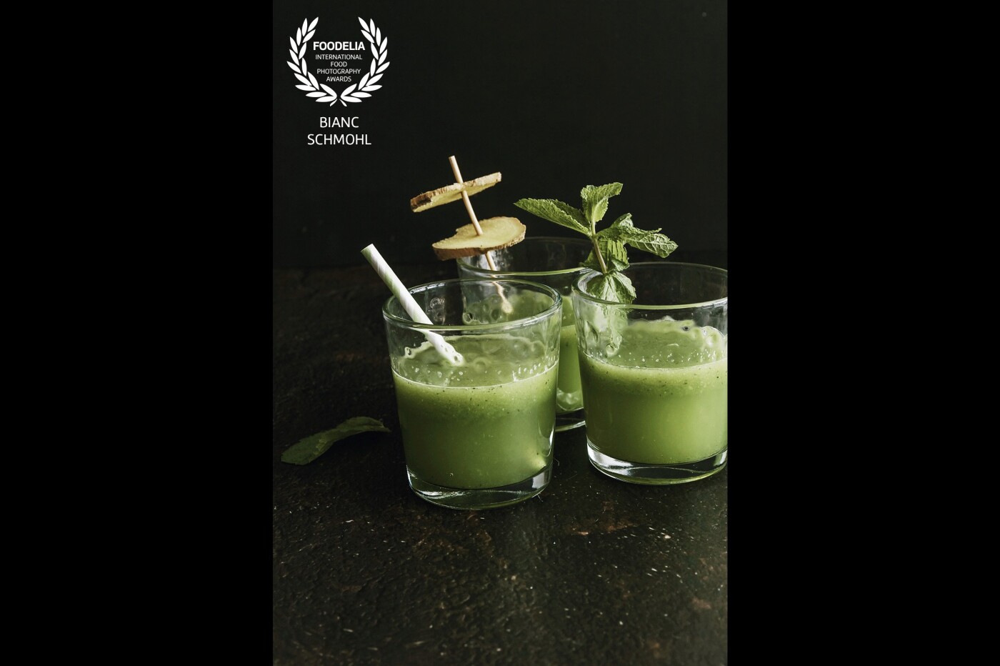 Green healthy summer drinks. Your best friend on hot days, at home or on the beach. Decorating the glasses with fresh ginger and mint twigs brings a lot of happiness and joy in the photo.