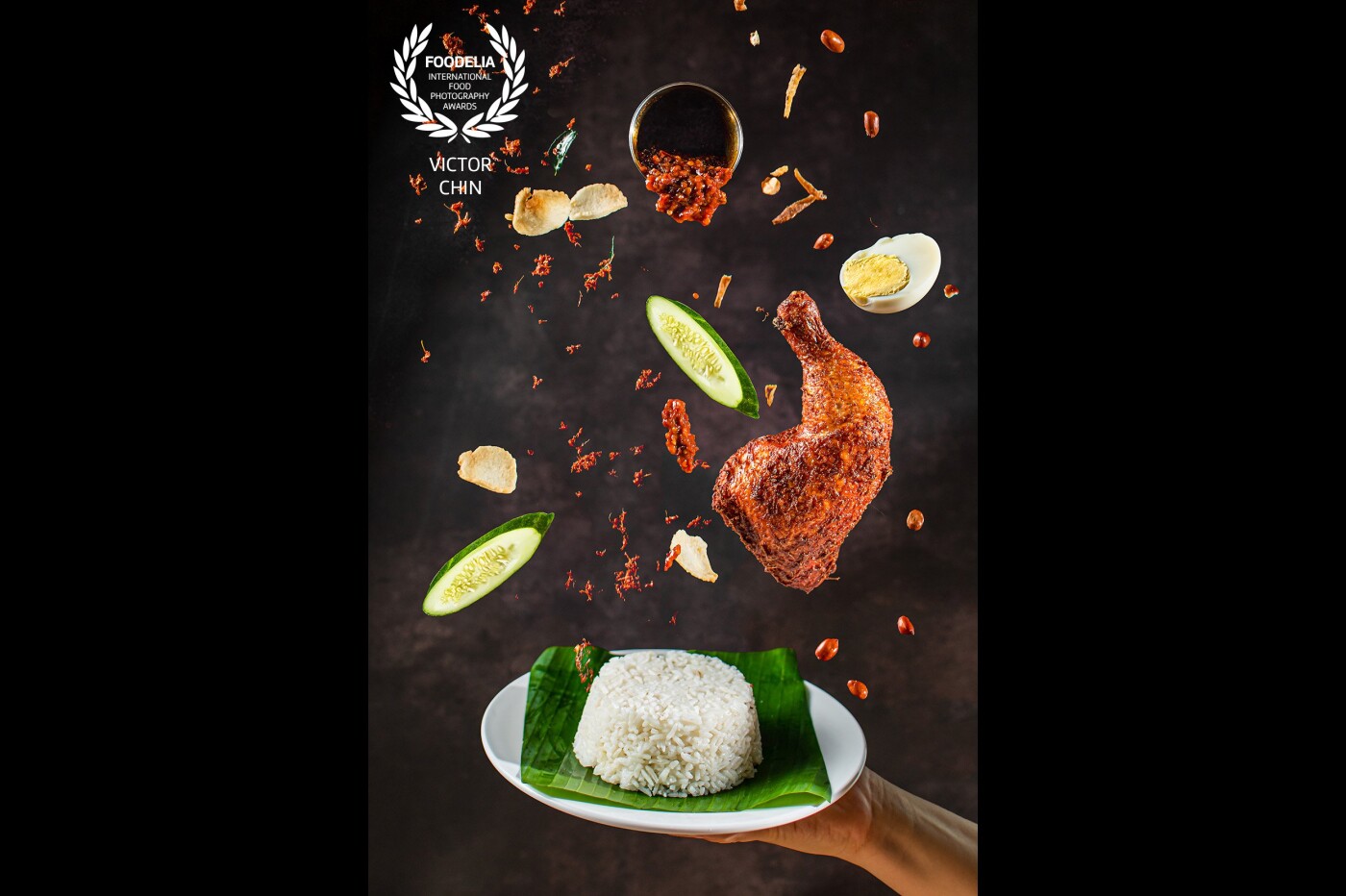 Nasi Lemak! This is Malaysia’s most flavored signature dish and the most sinful big breakfast for all Malaysian. The aim of this picture is to surface all the flavors and ingredients of the Nasi Lemak and to be printed on the front page of the restaurant menu. 
