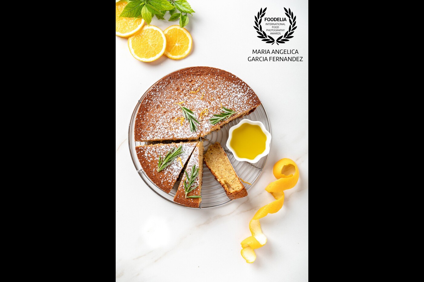 Olive oil cake with Rosemary and oranges. It made part of my recent blog post for November- December on my food blog. Celestial beam photography and also a collaboration with an International Olive oil brand.