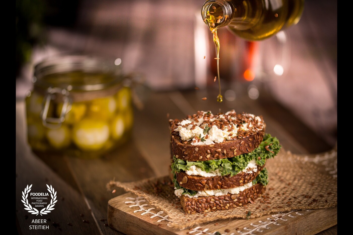 This sophisticated piece of heaven will take you back to your childhood reminiscences of your mom’s traditional loved flavors. This gourmet Labneh sandwich is made with delicious multi-grain bread and layers of a unique sharp salty flavor of Labneh topped with toasted sesame seeds and a generous drizzle of extra virgin olive oil. 