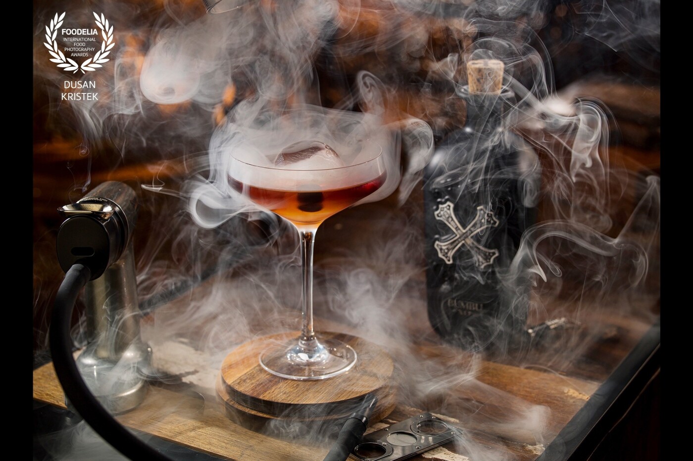 I like smoke in photos. I like rum <br />
So picture with smoked rum is my heaven :D<br />
combination flashes and tungsten light.<br />
Bartender: Tomas Gyen