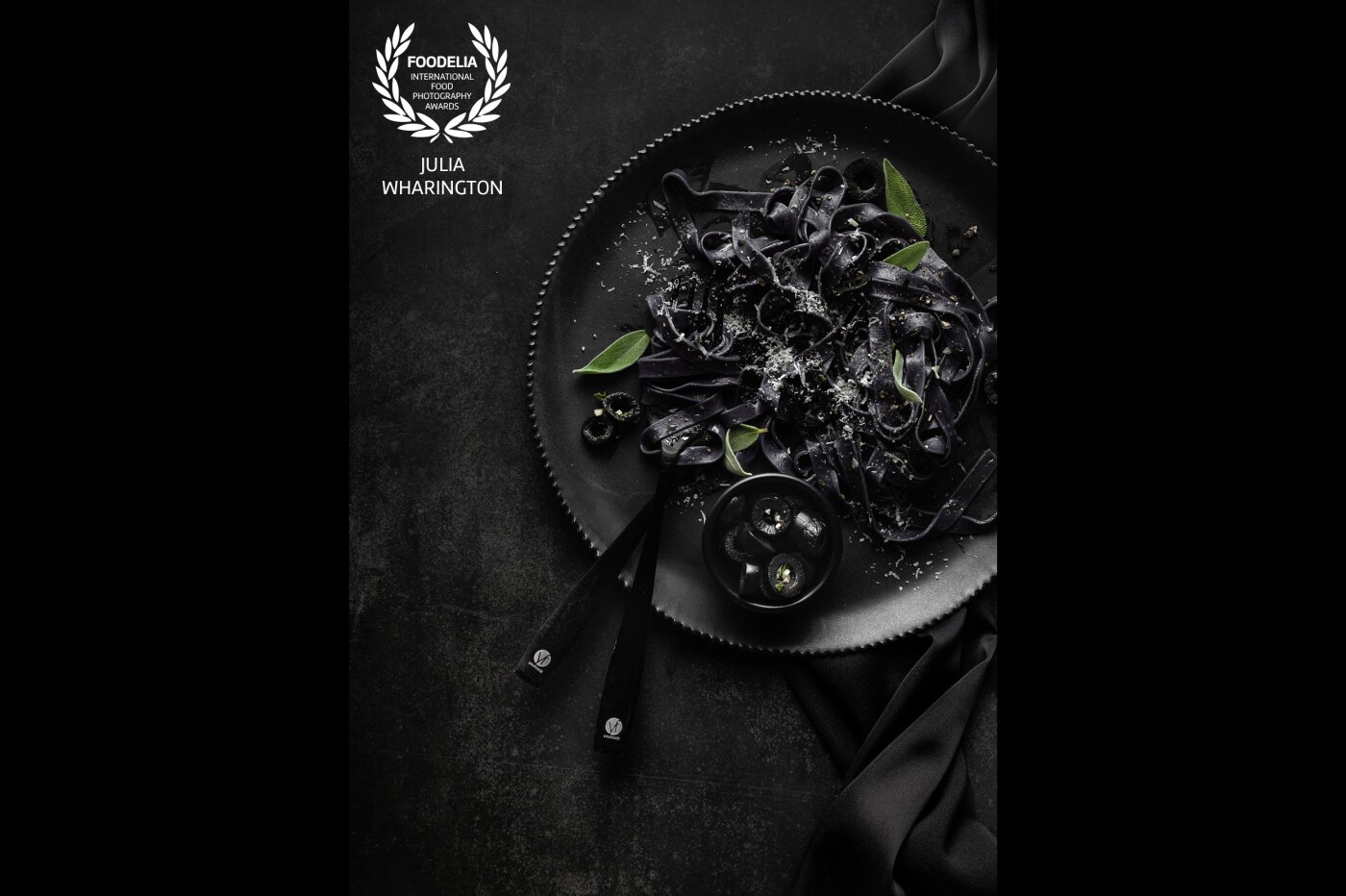 A classic black-on-black shot of some squid ink fettuccini with black olives. Loved playing with a very monochromatic scene, where the difference between light and shadow is minimal, and the only bit of colour (the green of the sage) is welcomed by the eye.