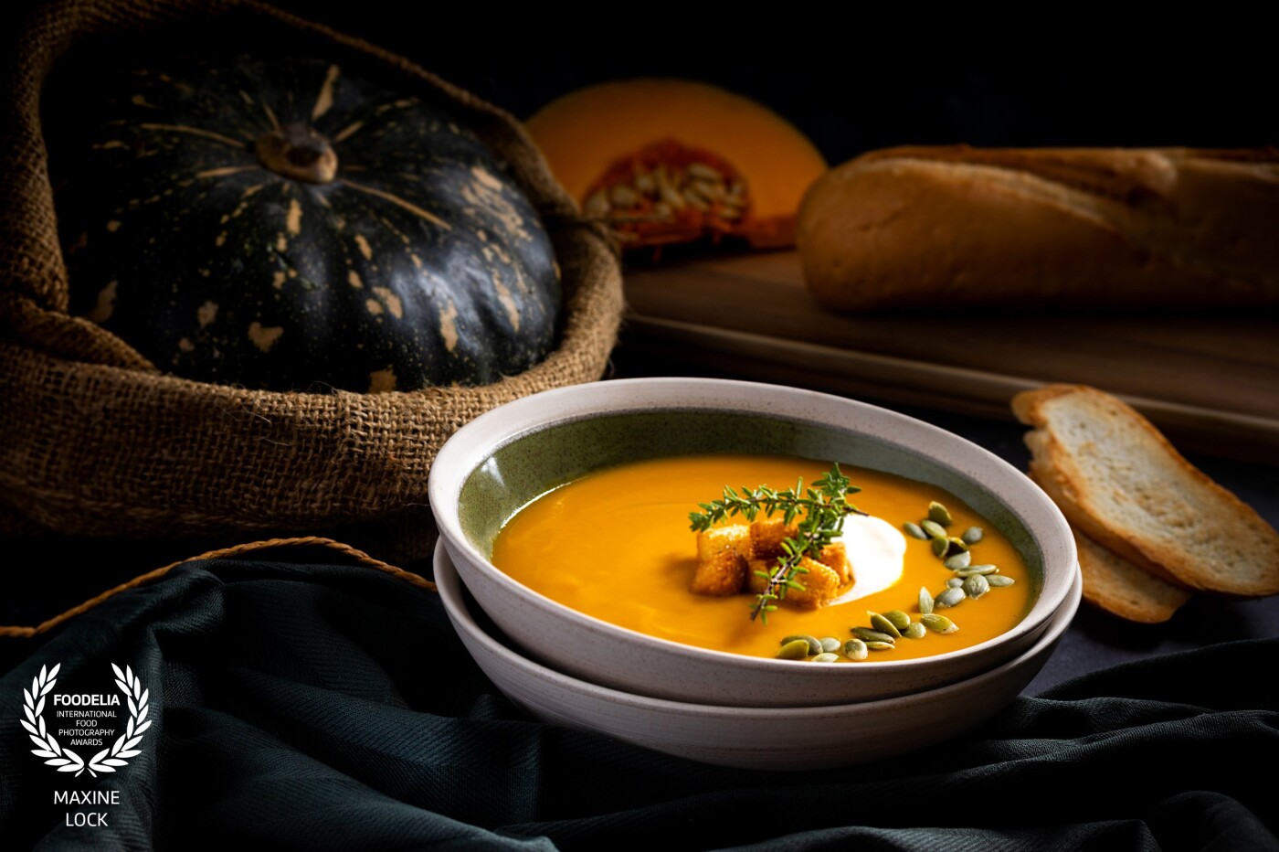 Pumpkin soup in a bowl, where I tried to create a warm and cosy feel to the image, however with focus still being drawn to the soup itself.
