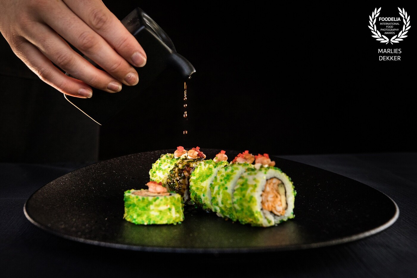 As a real sushi lover, the Saturday night sushi was my friend again. I used a simple background (black cotton) and added some flashlights to put the sushi and the sauce in the spotlight.