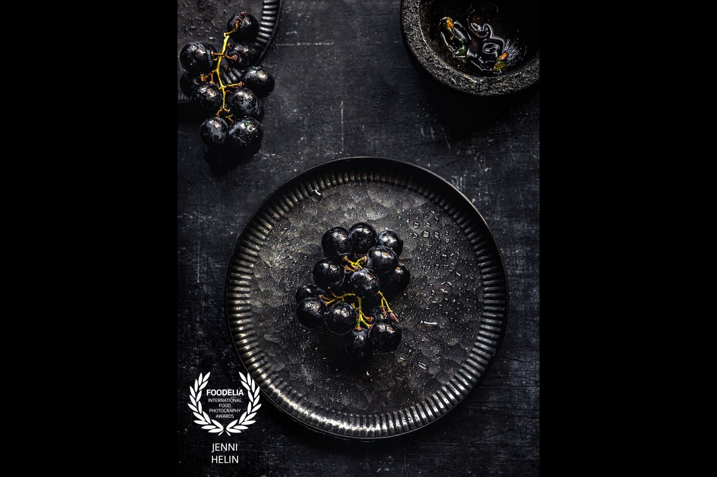 This image is part of my personal creative series - all about fruit. I wanted to celebrate monochromic Food Styling with blacks and greys. This was taken in my small studio in the UK just by using natural light.