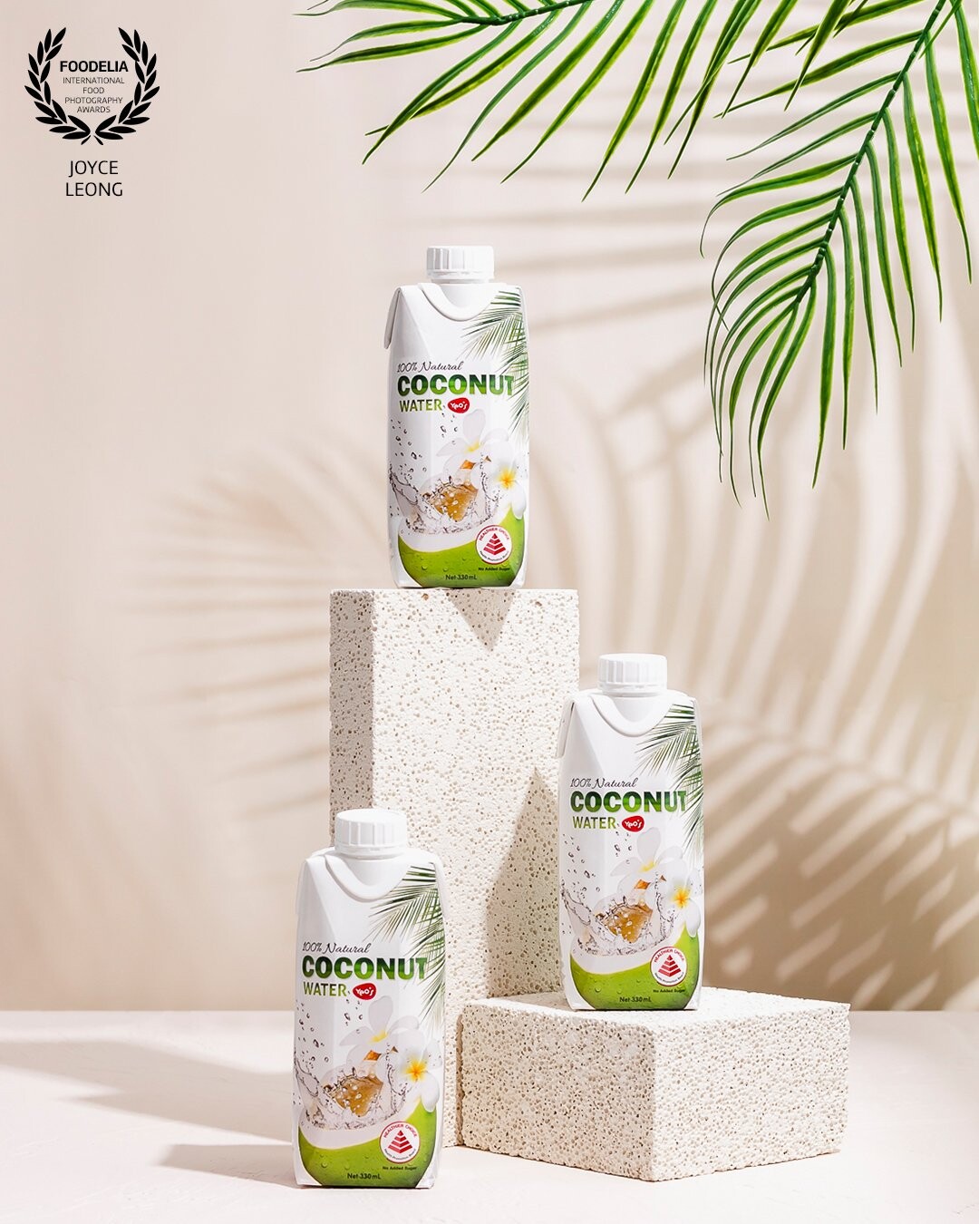 I wanted to create a beach theme around coconut drinks thus the choice of hard light and shadow of the palm leaves. The colours were kept neutral so that the branding of the drinks would pop.