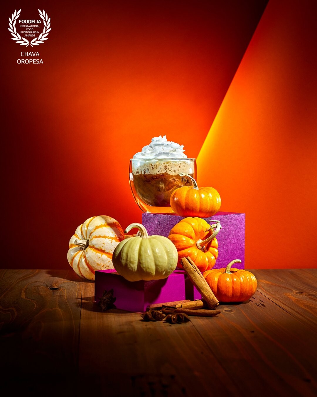 It’s the season that pumpkin takes over!<br />
<br />
It seems that everyone waits on pins and needles at the beginning of the Fall season for when the Pumpkin Spice Latte drops across most coffee brands and bakery shops.<br />
<br />
In preparation for this seasonal classic, I put together a shoot creating hero images featuring coffee drinks. Color backgrounds and warm wooden textures help convey the message. I also wanted to use prop elements that brought a different color palette to the classic orange and brown Fall colors. Introducing the purple props makes the image more contrast and adds visual interest.
