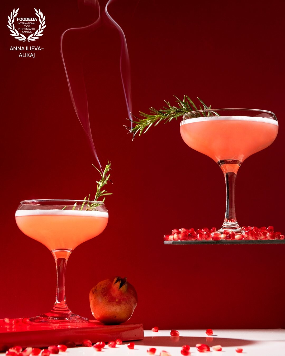 Gin fizz pomegranate cocktail - mix of gin, lime and pomegranate juice, plus decoration with egg white foam which technically makes the cocktail "royal". And my personal touch - the steaming rosemary. It is really easy to prepare even at home, just be very careful with the freshness and the origin of the eggs.