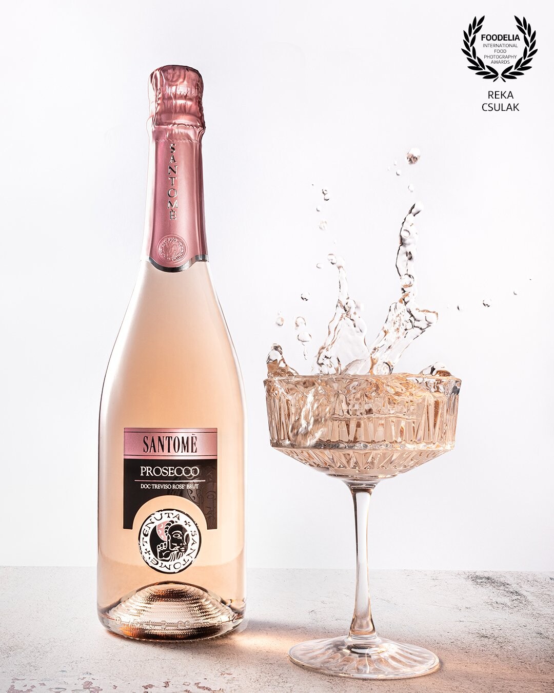 Splash action with the prosecco product from the client's store. Simple styling and environment with eye-catching action-details.