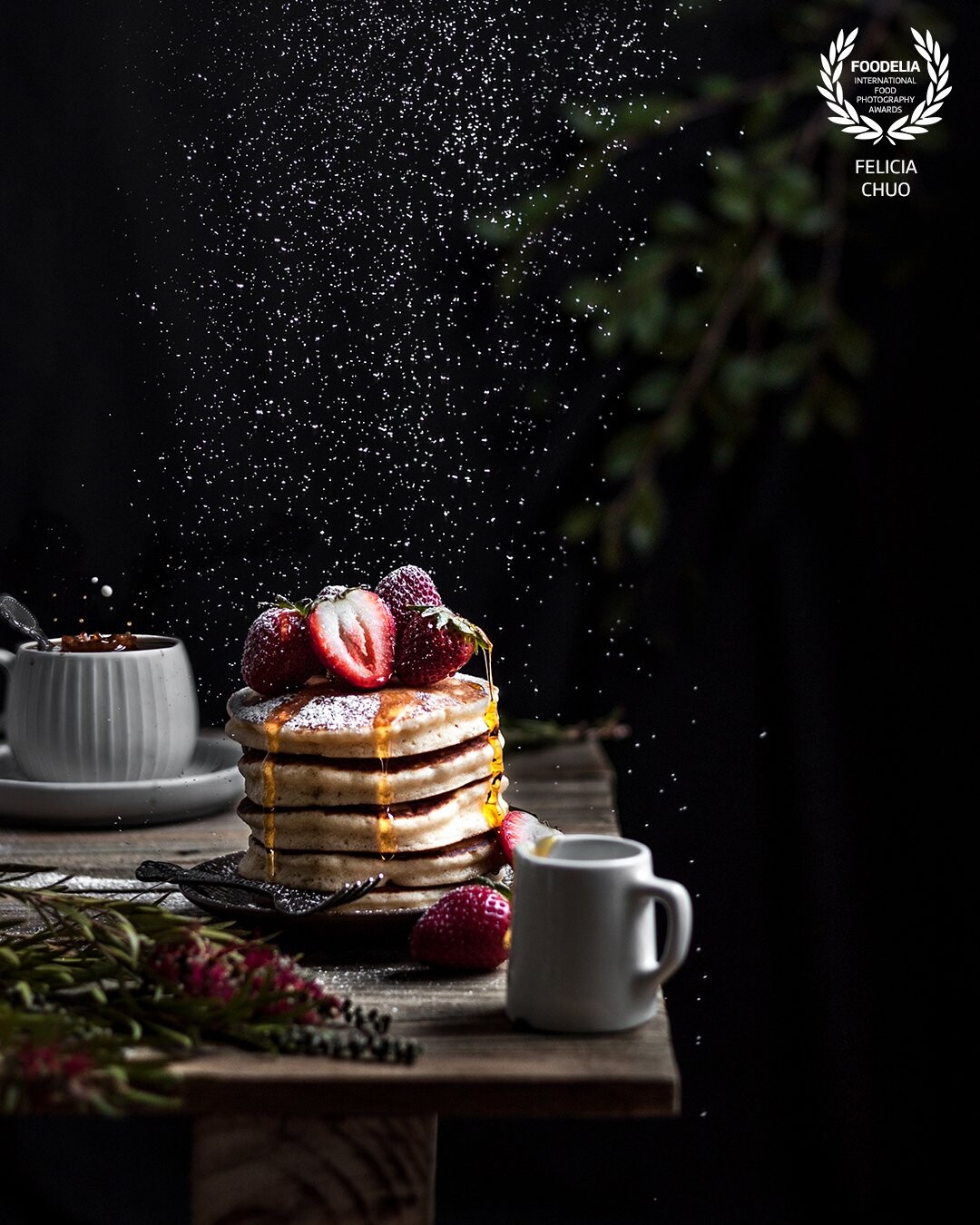 This shot is a composite of 6 shots and was shot with a speedlight. I wanted the pancake stack to have an almost magical glow to it, which I emphasised through editing. I thought it'd match all the magic-like movement in the image.