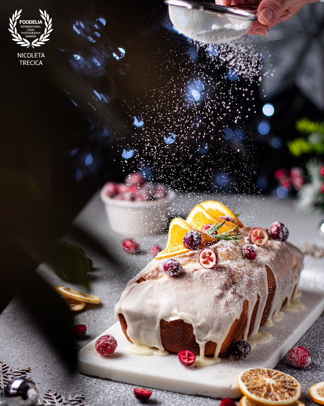 A delicious orange loaf cake with cranberries and orange decoration.<br />
I tried to create a festive atmosphere, Christmas time being very close.