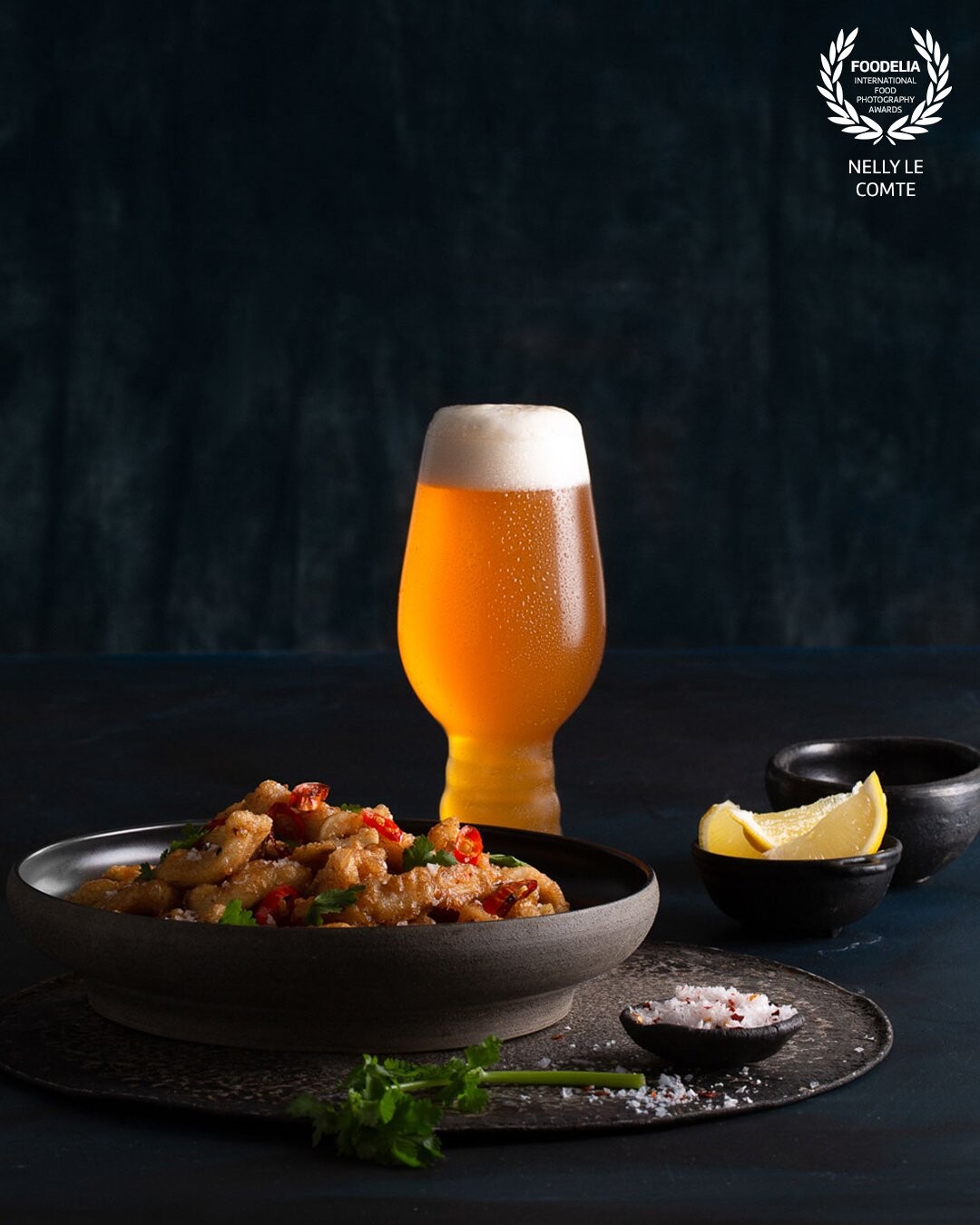 Studio photography with food stylist @janetmitchellstylist working on beer. Being creative with one @bowens light in a way it illuminates the food and highlights the beer in the glass. Ask me how ???<br />
Photographed with Canon @canonaustralia<br />
Loving the golden toned calamari which certainly was a treat to eat afterwards, along with the cool crips beer.⁠<br />
⁠<br />
Perfectly planned the shoot on a Friday, so drinks allowed.⁠