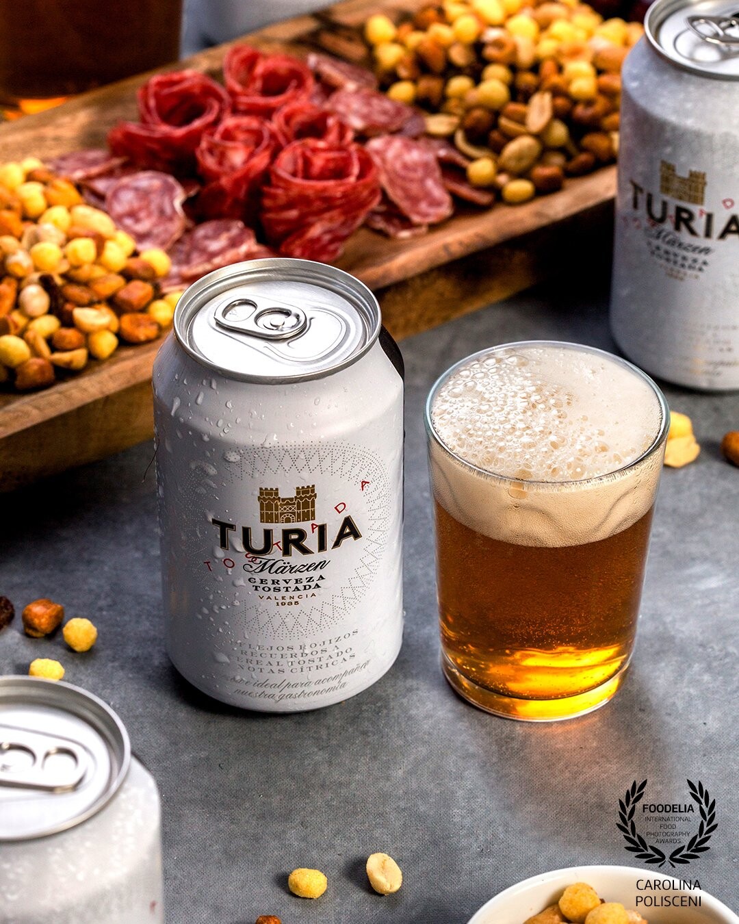The aim of this photo was to recreate a dinner with friends, giving the audience a sense of sharing and joy. I used this beer which is very known in Valencia to reach people´s attention in this city.