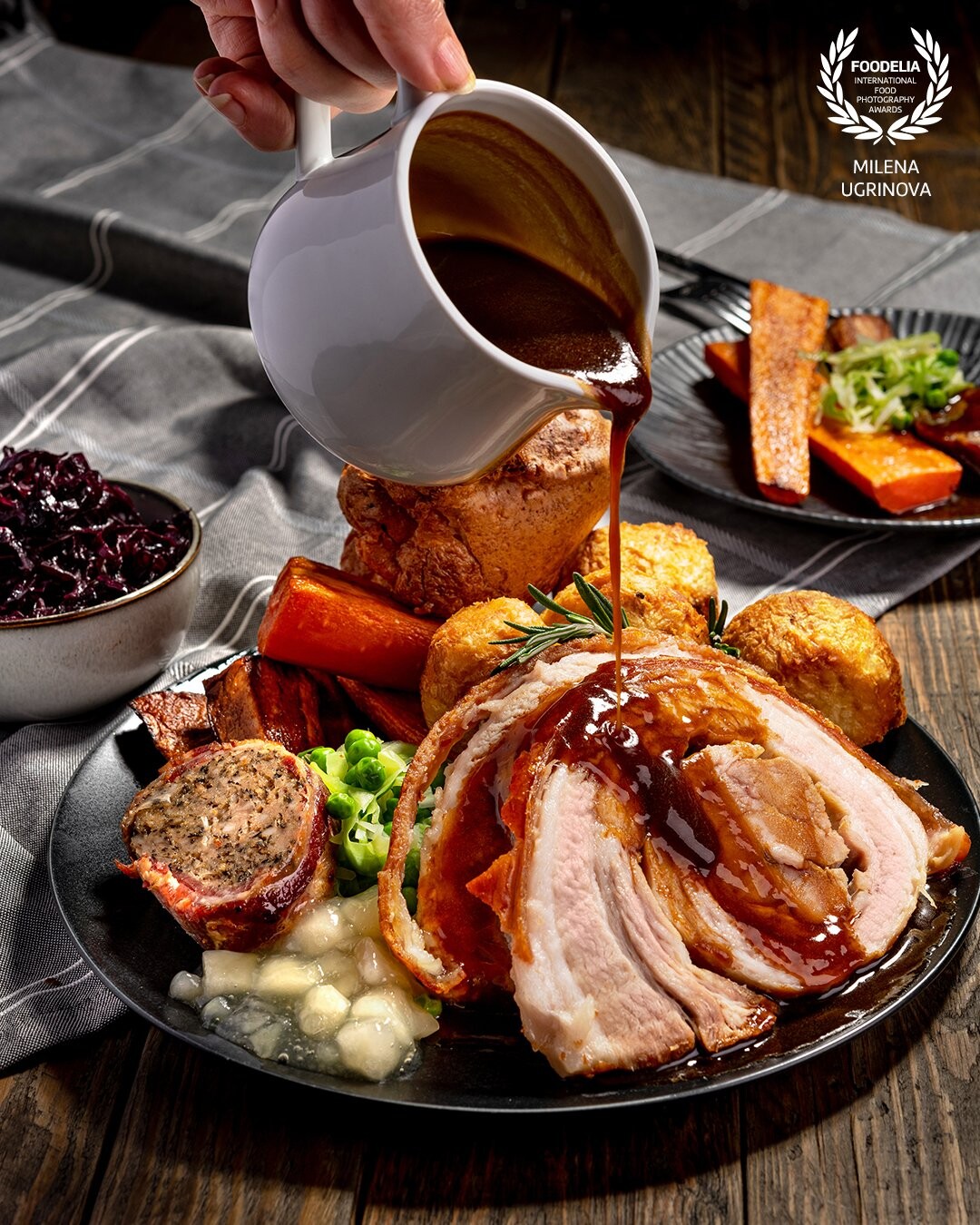 Tender perfectly roasted pork with roasties, smoked garlic honey glazed parsnips, carrots, greens, Yorkie, and homemade gravy.<br />
Chef Chris Murrey<br />
Photographed for https://roastwokingham.co.uk/ @roastwham