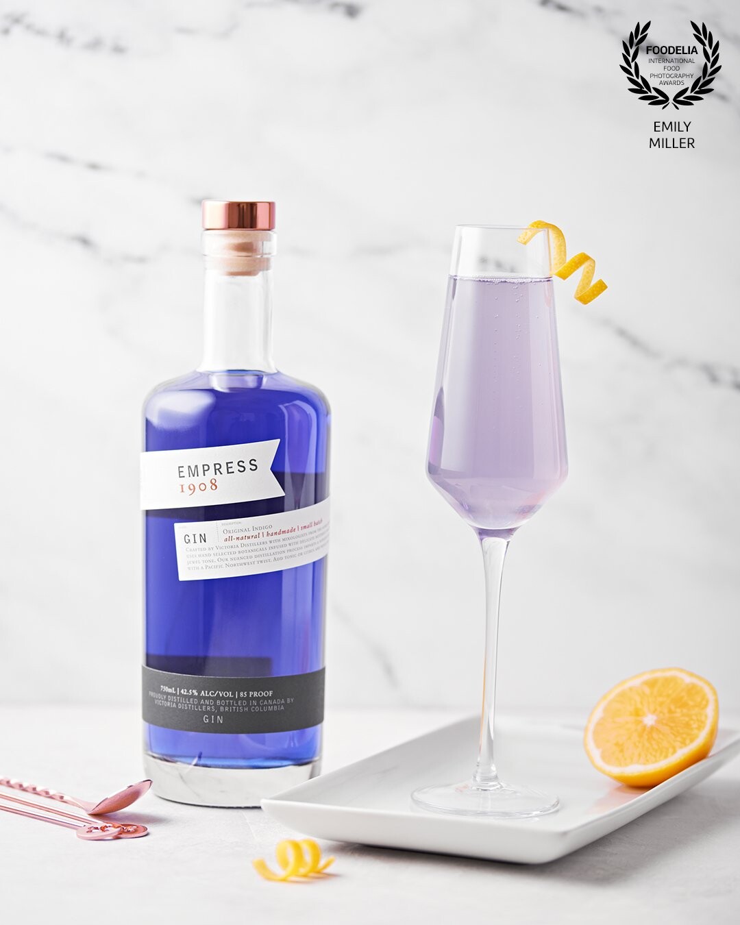 I shot this image of a Meyer Lemon French 75 with Empress 1908 Gin, accented by a fresh Meyer lemon twist. Diffused light from a softbox on the left with a white reflector on the right.