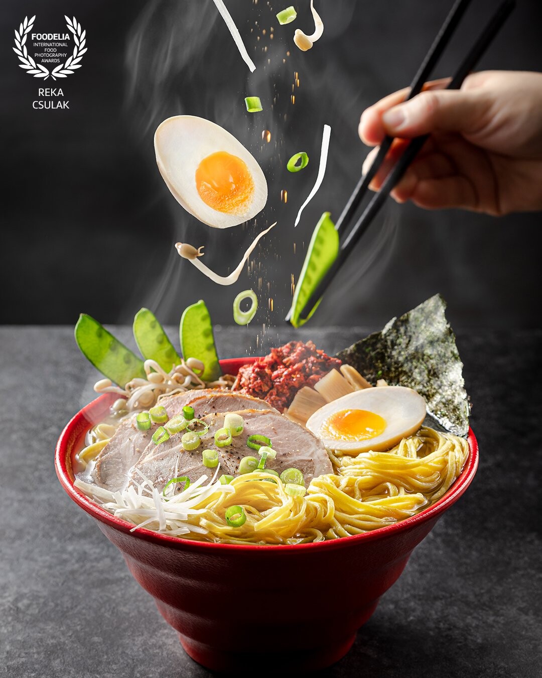 This has been a photo that ended up on a restaurant banner of the Client. It is taller than I am, and already in front of the place :) I wanted to show a cool action with this delicious ramen.