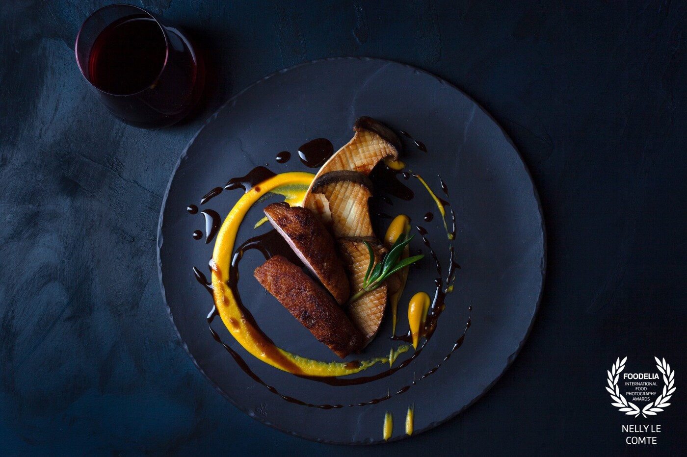 Enhancing the colours of the mushroom and duck breast with the dark plate and the dark handmade background. The chef's plating @jordanstaniford with the ochre tones of the dressing brings an artful display to the food. Restaurant photoshoot on location @crystalbrookbyron