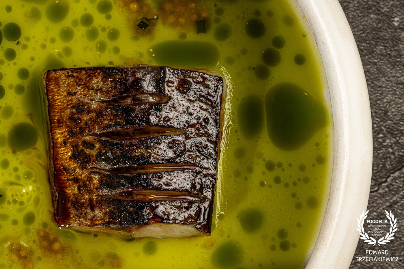 Interpretation of Polish sour cucumber soup - mackerel glazed with Polish teriyaki, fresh and sour cucumbers extraction, mustard seeds, dill and chive oil.<br />
Michelin starred Chef - Andrea Camastra, in his new Restaurant „Nuta” / Warsaw.