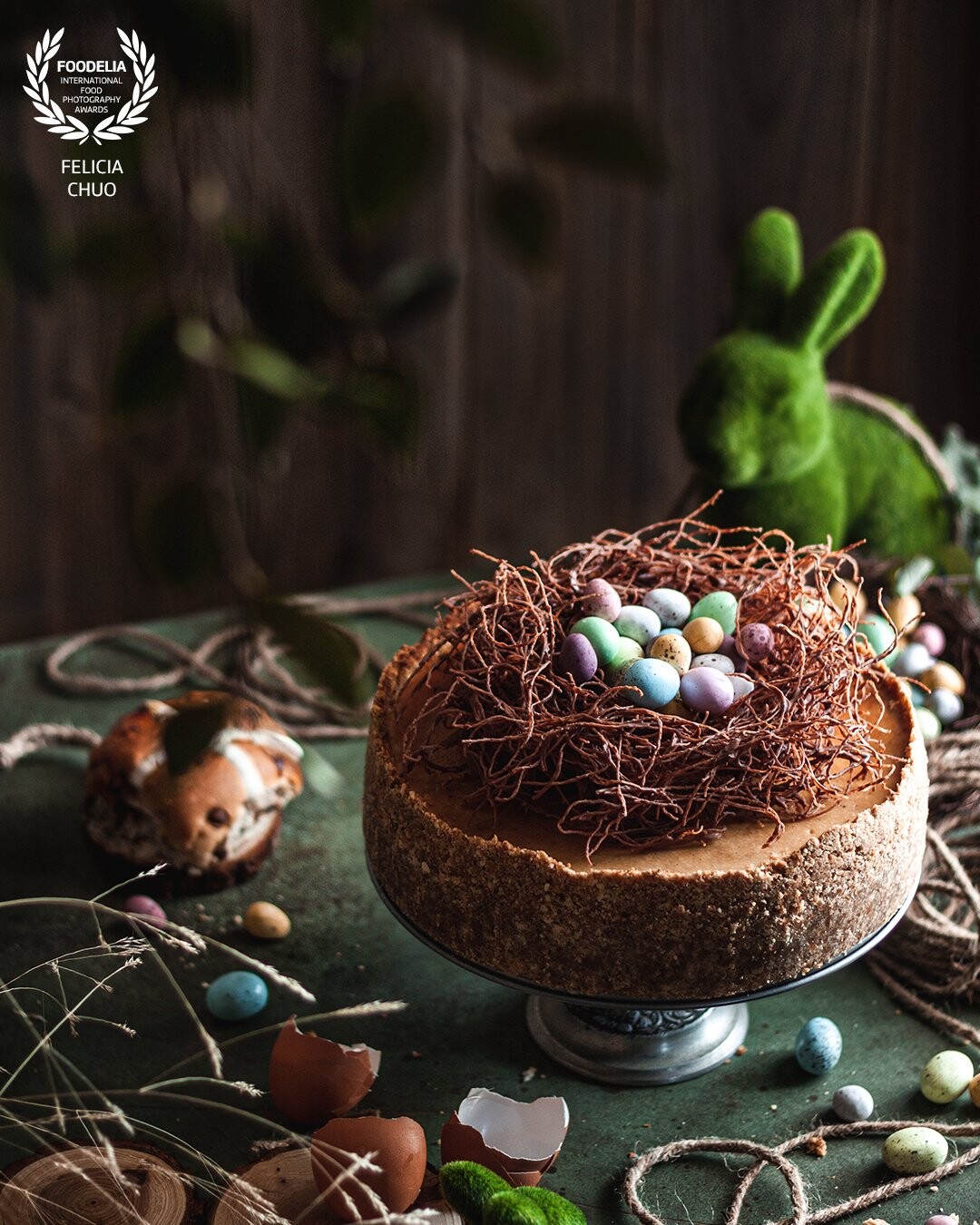 An Easter hot cross bun cheesecake. Wanted to give the feeling of some kind of woodland (and also play around with a new backdrop!), hence all the greens and kind of neutral browns. Shot with natural light.