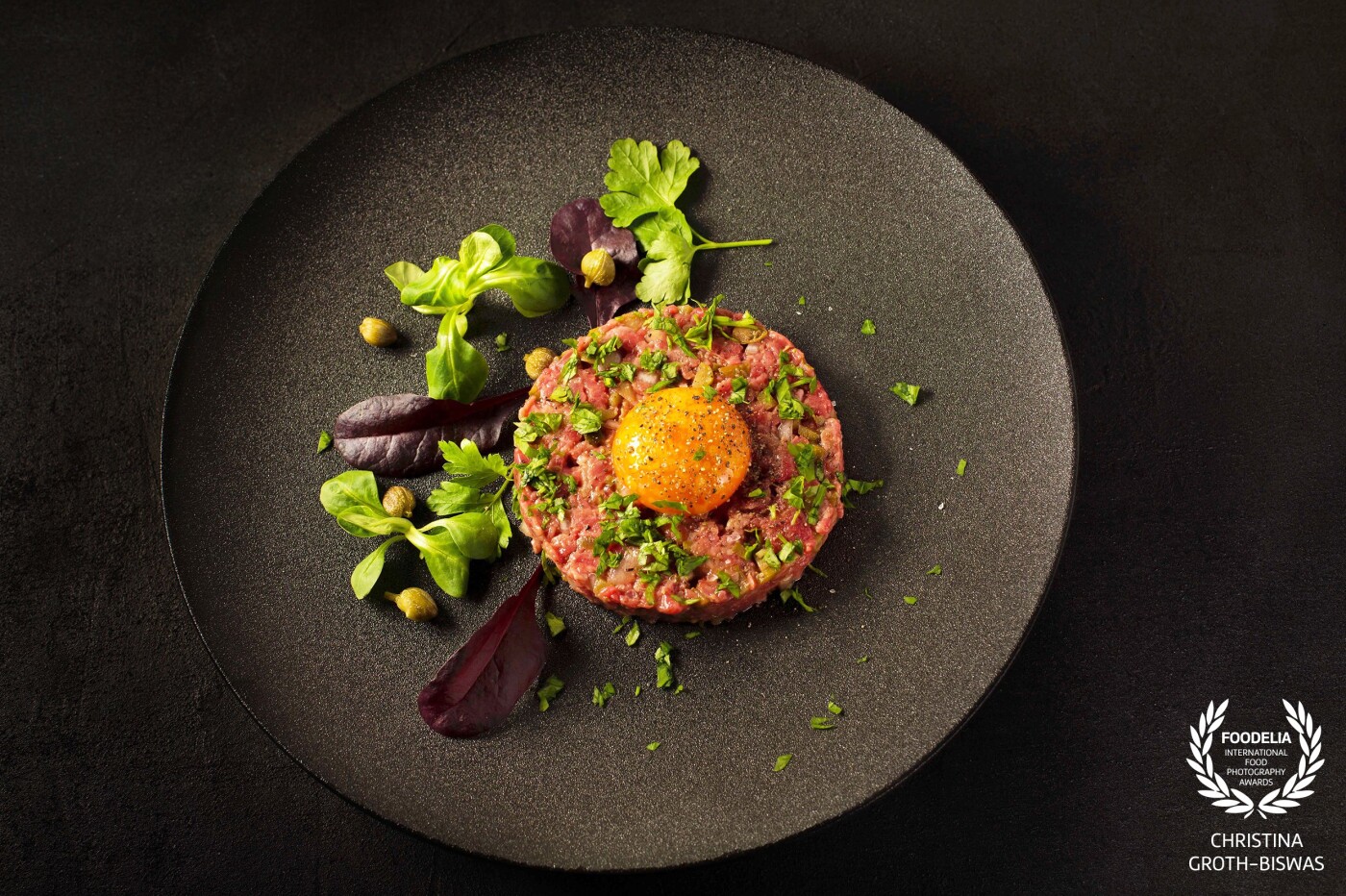 Steak tartare, served with some simple greens on the side. This is one of my favourite dishes using only the freshest ingredients considering it is raw.