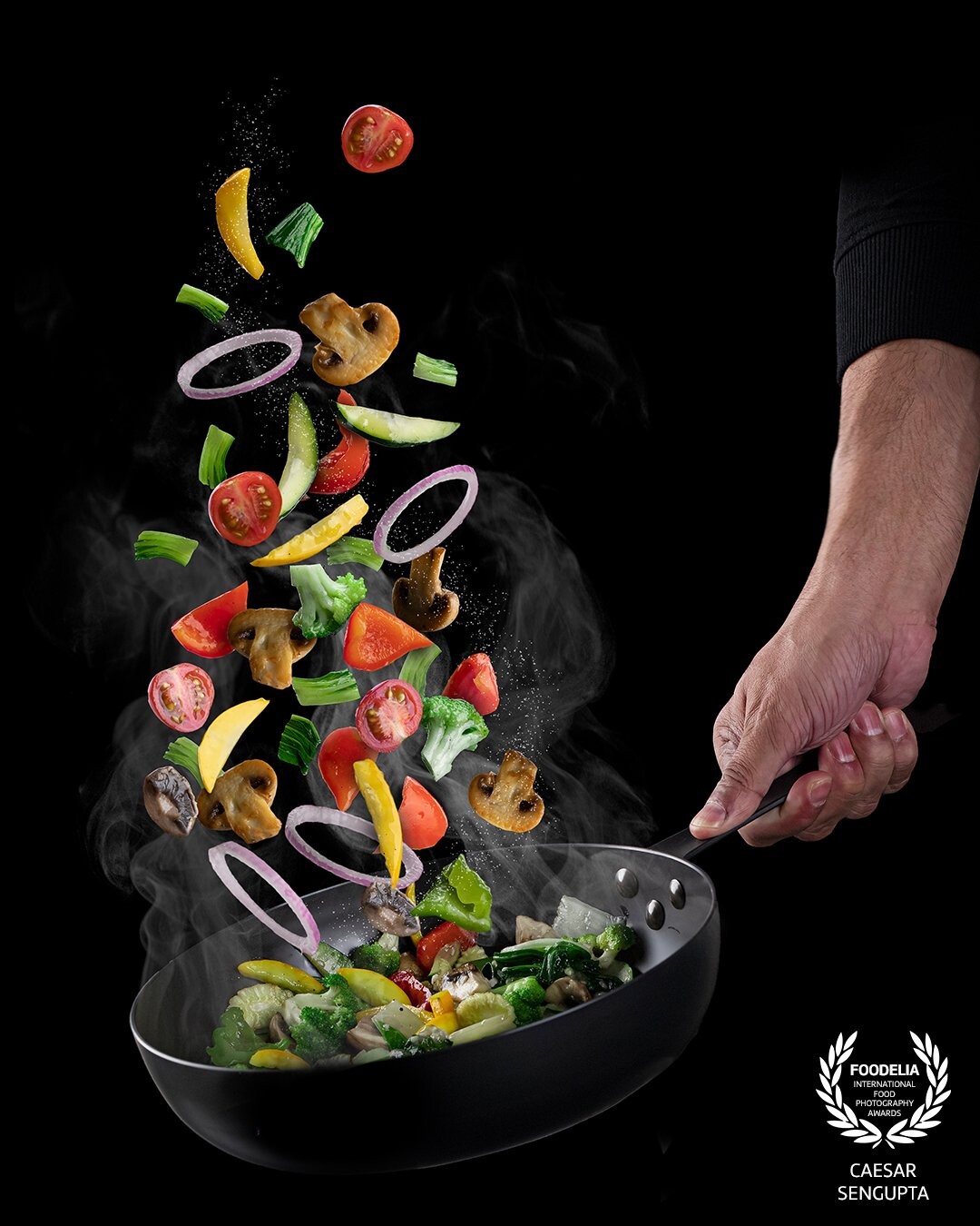 Its a composite food levitation image. The idea was to showcase the colours of the food. The chef's hand adds the human element which is a key component as well in the frame.