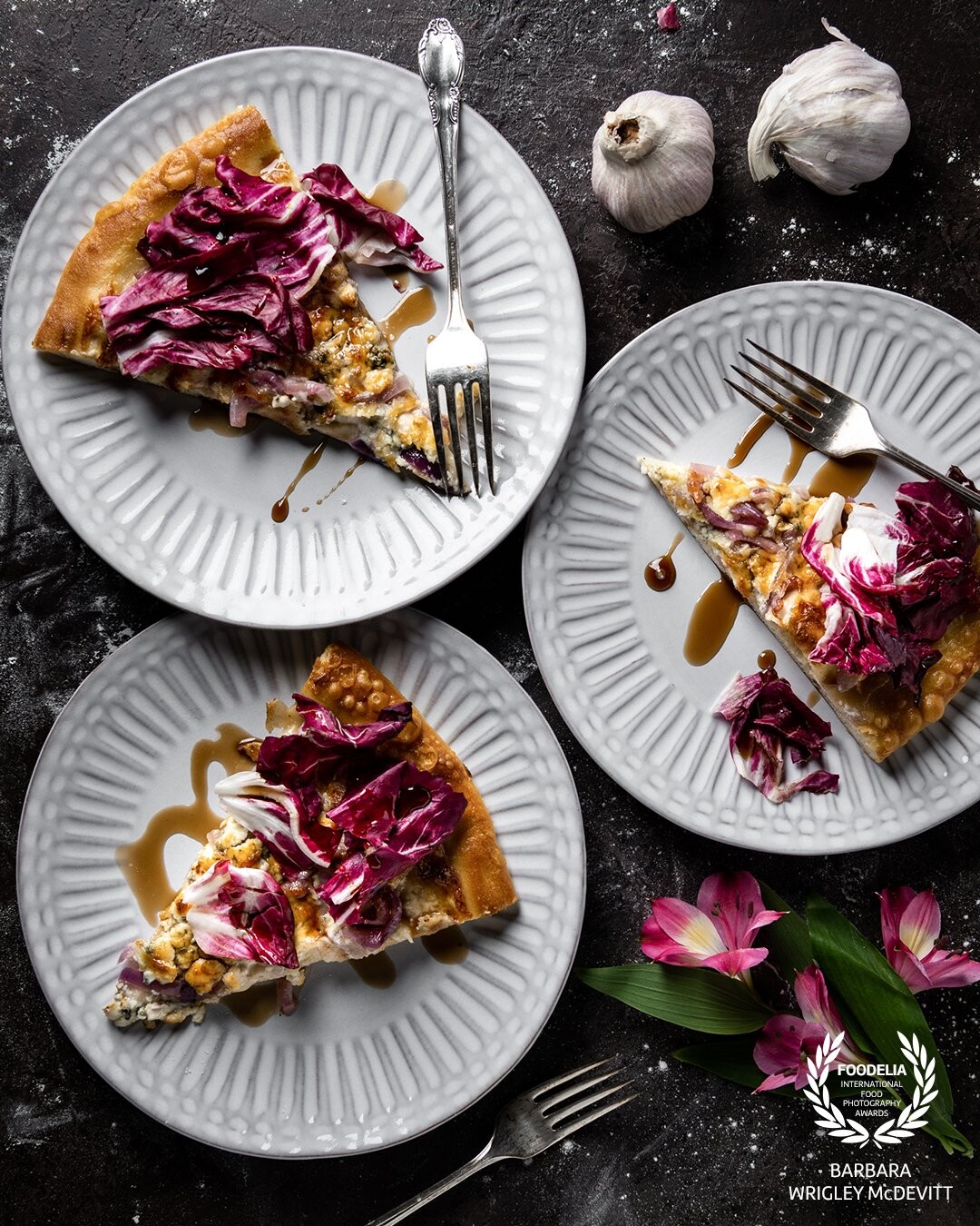 Pizza is definitely one of my favorite foods.  This pizza includes blue cheese and radicchio atop an Alfredo sauce with a balsamic vinegar glaze.  The color of the radicchio visually brings out the best of this pizza.  Anyone care for a slice?<br />
<br />
Shot with the Nikon D850 and 24-70 mm lens.  Indirect lighting with a Profoto B-1 pointed into a 36 inch white parabolic umbrella.