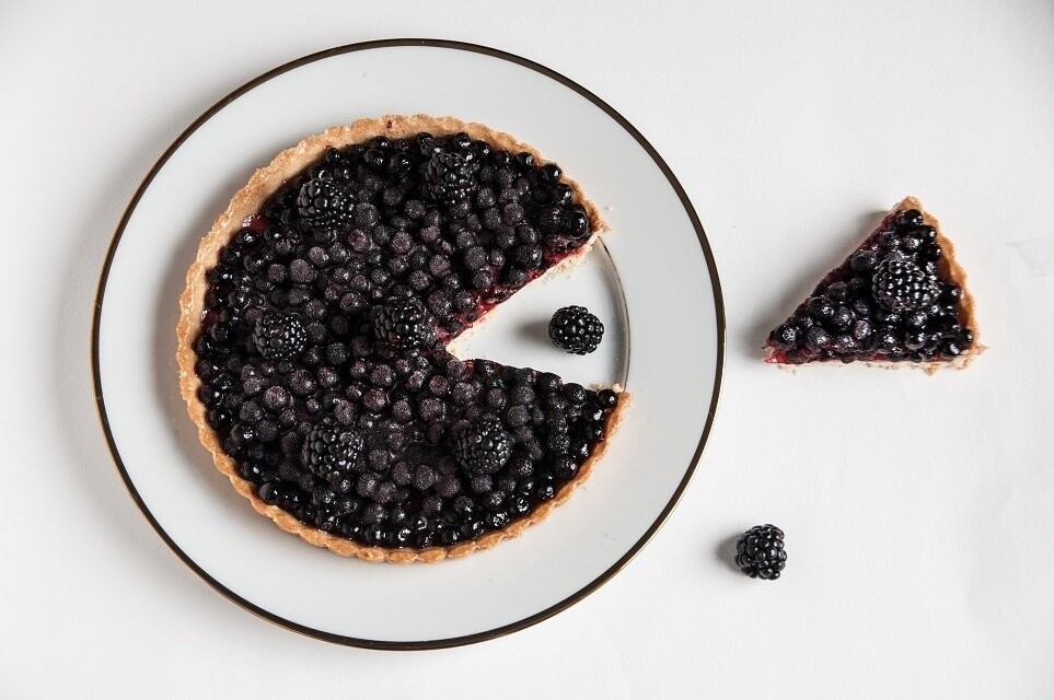 This photo is a part of a series called "The black tart" made for a French pastry cook. Taken on the top, it is a small wink humor to the Pacman. A greedy Pacman!