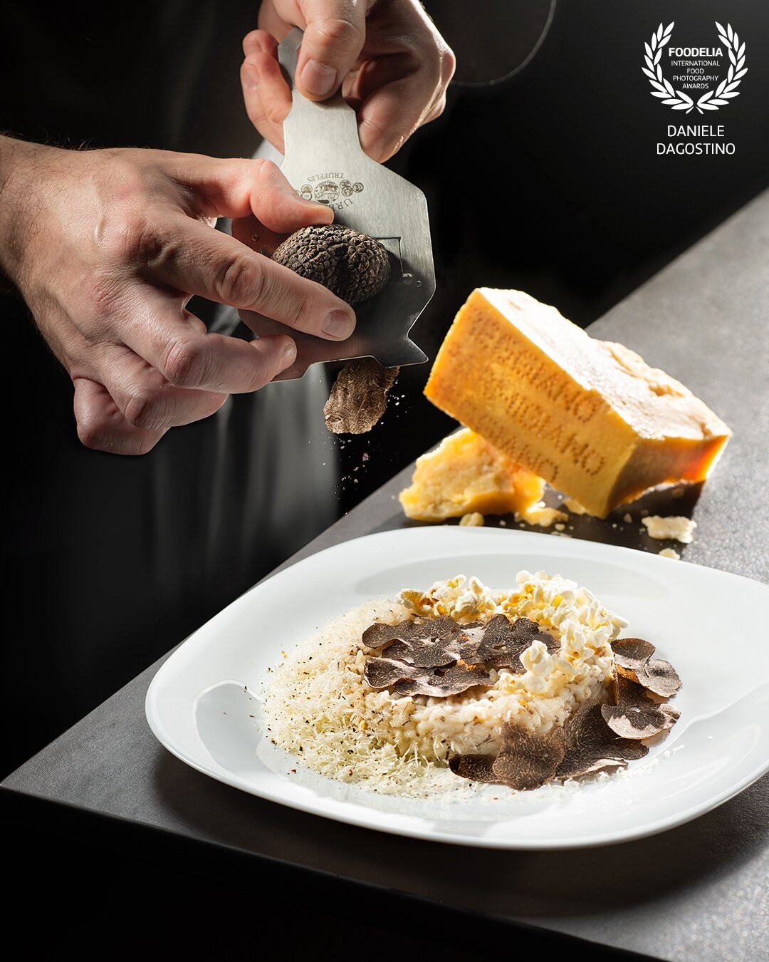 Risotto is an Italian tradition that pairs wonderfully with truffles and popcorns.  recipe by chef Michele Casadei Massari.<br />
Shot by Nikon D810 and Nikkor 24-70 f2.8. 2 suorce of light.