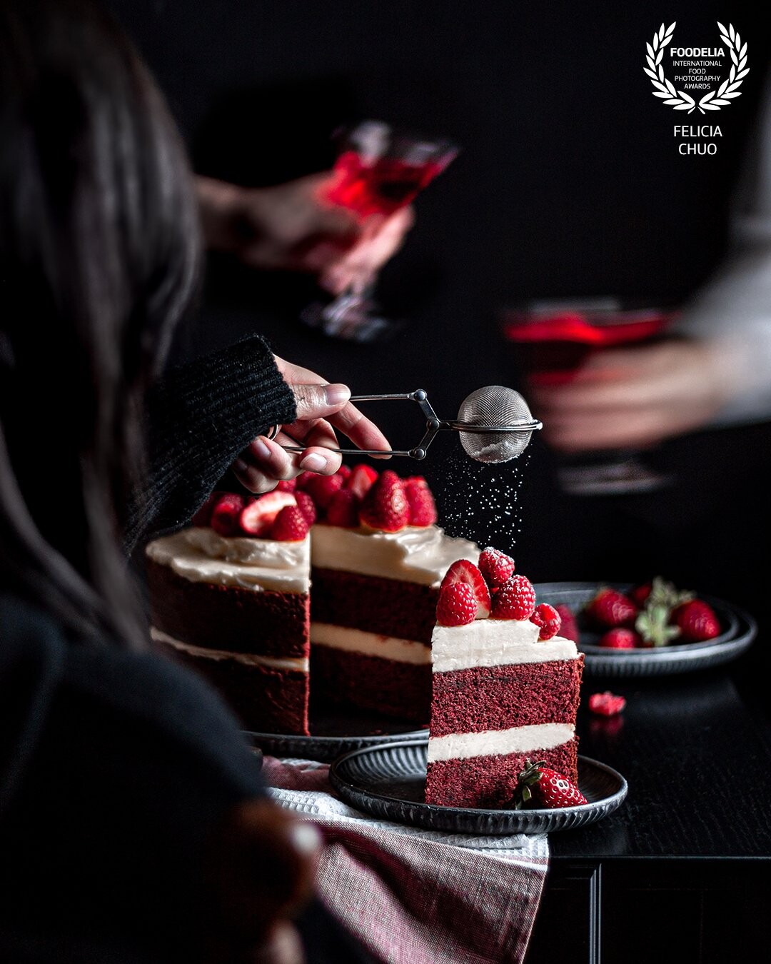 Red velvet cake with a juxtaposition of blurred and frozen movement. Composited together in Photoshop. Although it is a crowded scene, my aim was to still lead the eye back to the hero slice.