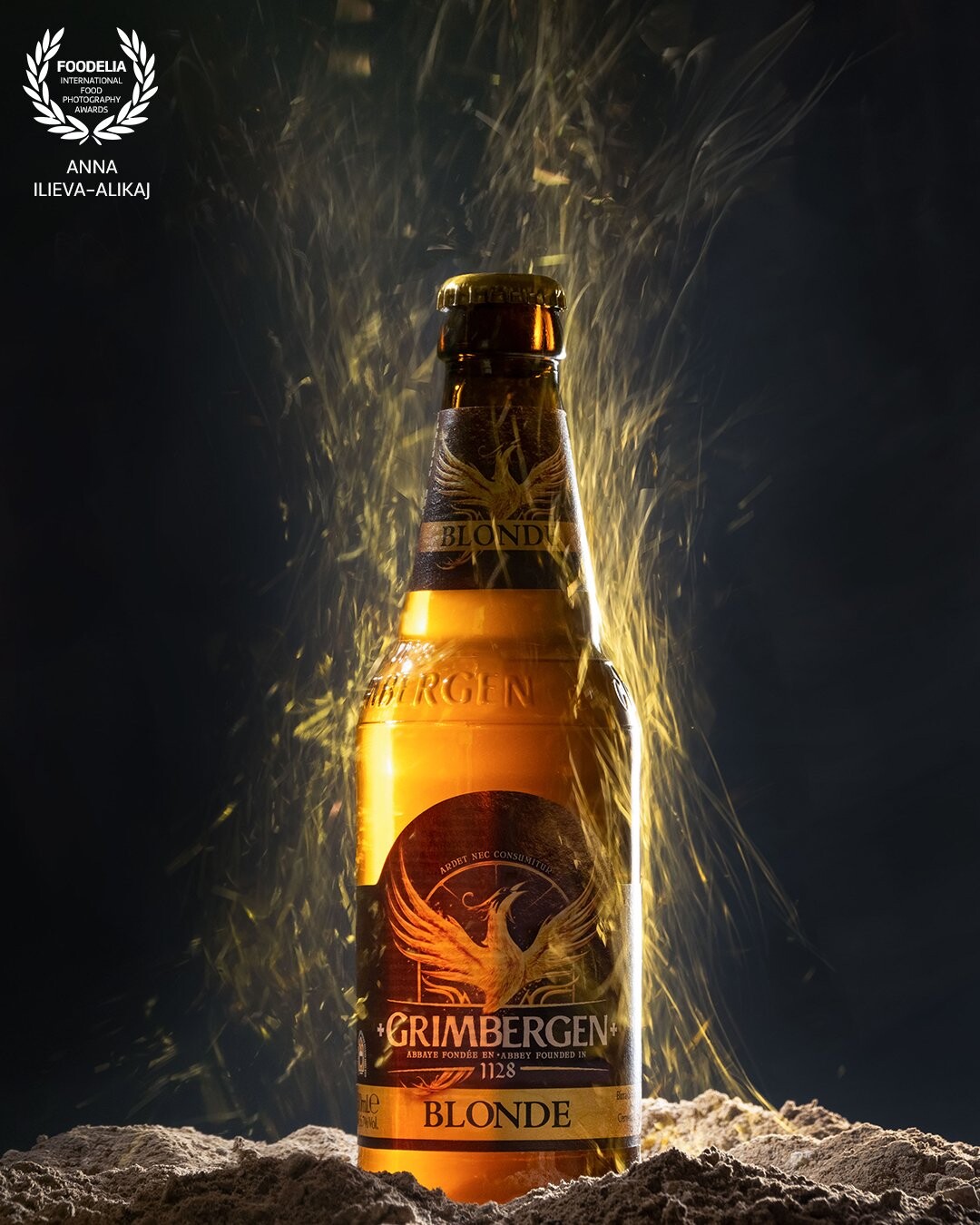 The story of the Phoenix has inspired many people (including me ;) to believe in themselves and to find strength within themselves especially when going through a difficult period in their lives. So when I saw the beautiful label of this beer, which by the way has excellent taste, I already knew how I would like to take this shot. The rest of the story is absolutely technical - real ash, one light source and a reflector. Two images combined in one.