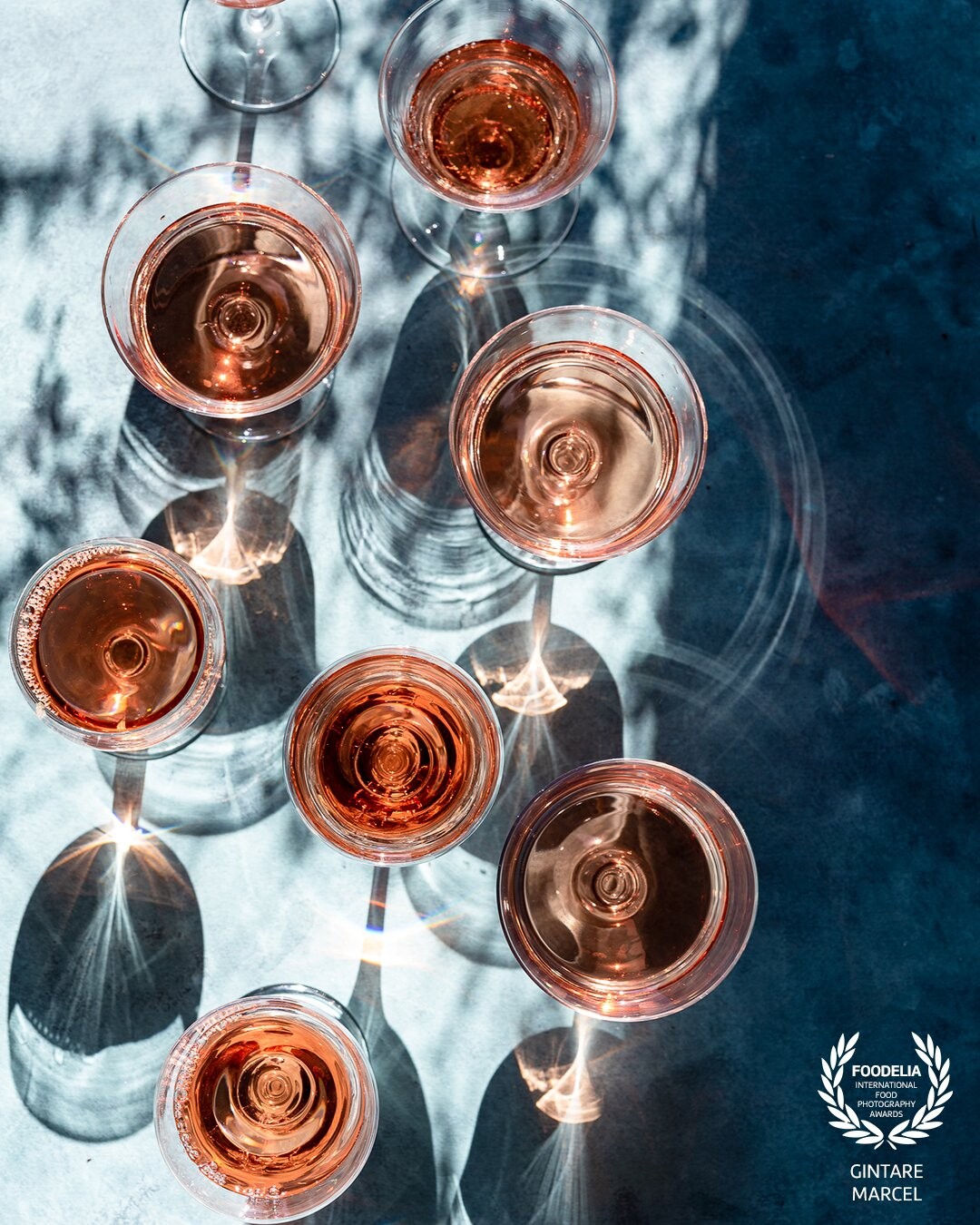 Essentially summer. This image was part of a series to highlight rose wine as the summer drink. For which hard light and creative shadow play worked best to tell the story.