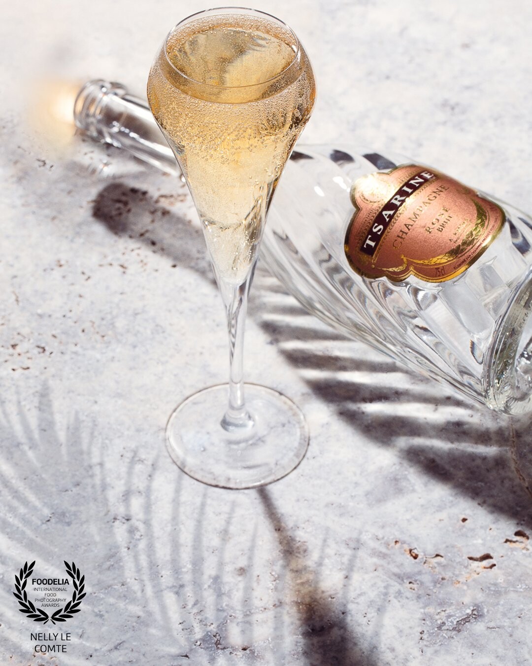 Drinks, light and shadows have been a favourite way of shooting for clients for many years and this image of @champagne_tsarine lend itself perfectly due to the interesting glass of the bottle. A studio light with snoot to give the long stemmed glass the shadow plus to allow those delicious champagne bubbles to appear. Plus a soft box to illuminate the travertine background and add shadow to the bottle.